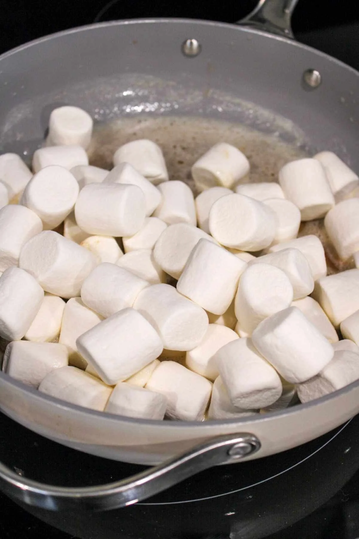 large pan featuring a mix of brown butter and large marshmallows.