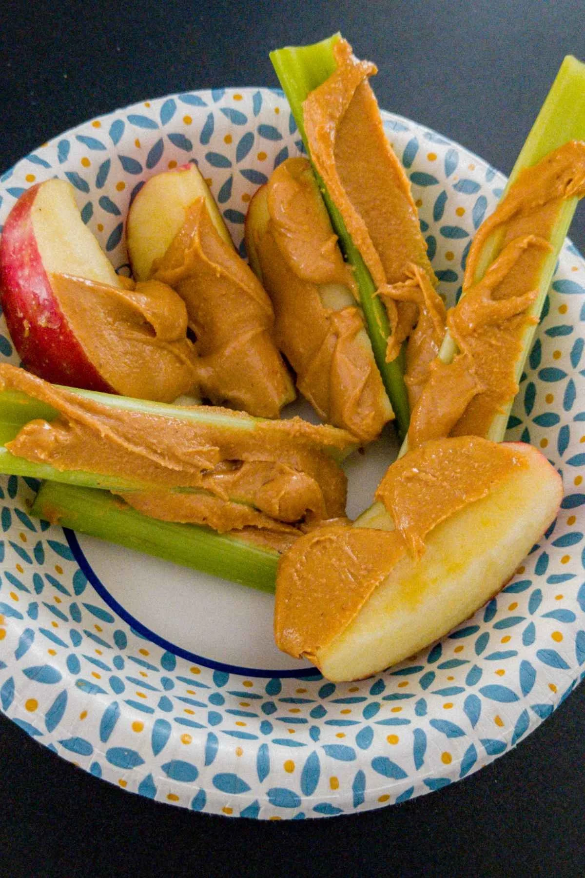 celery and peanut butter served with apple and peanut butter for a healthy school snack idea.