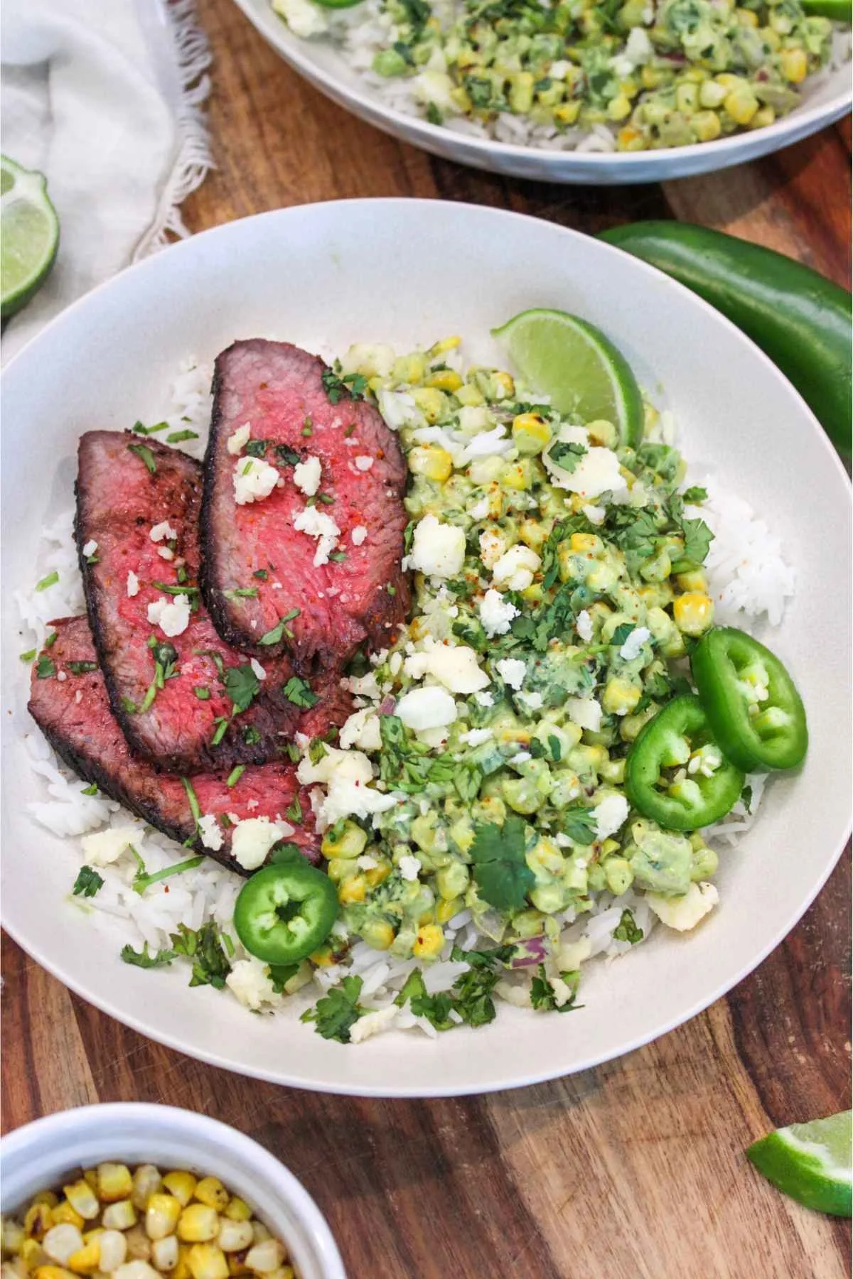 grilled tri-tip paired with a zesty street corn and served over cooked jasmine rice for a balanced rice bowl dinner.