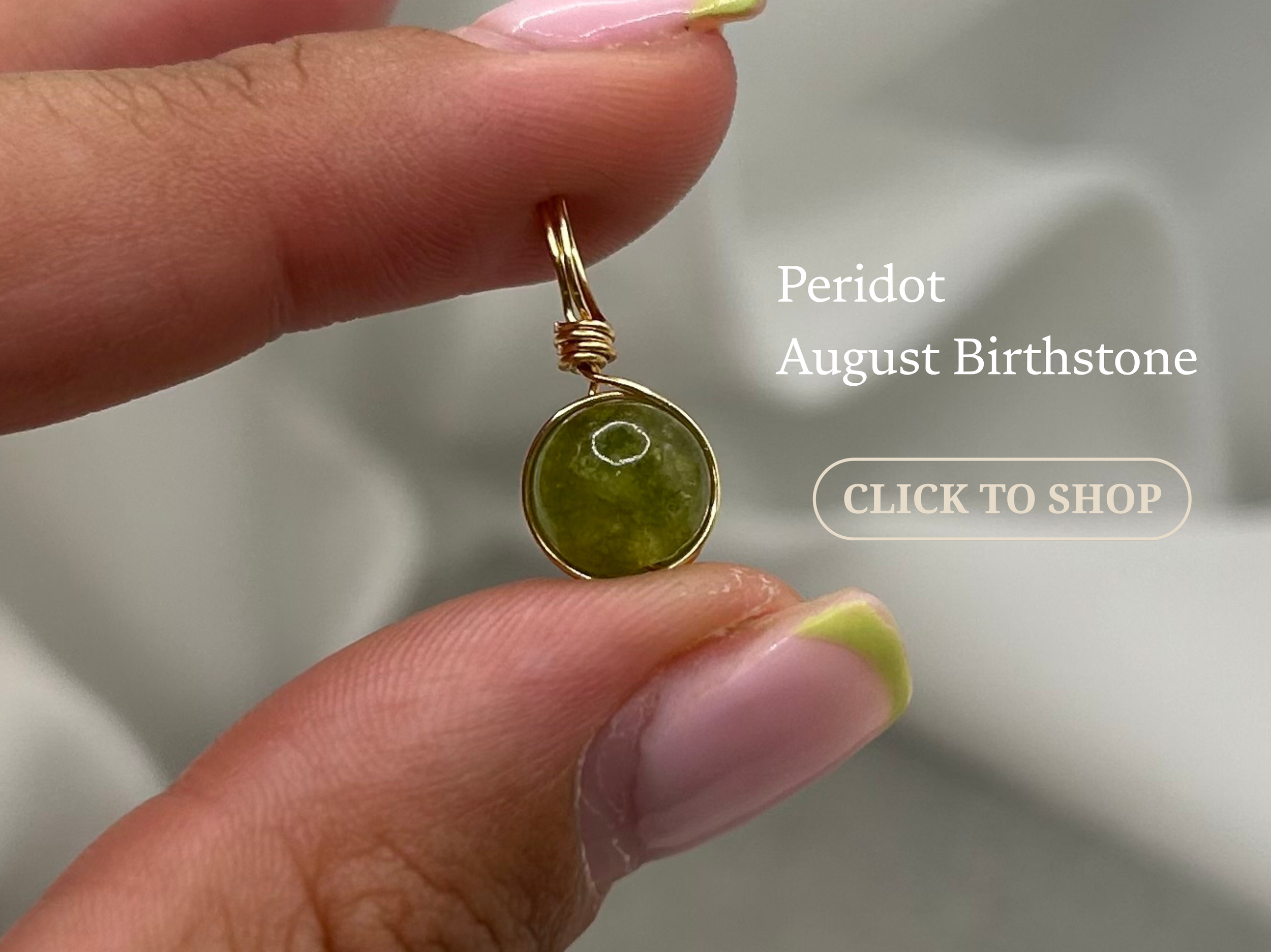 A hand holding a gold ring with a round, green Peridot birthstone pendant. Text on the image identifies it as 'Peridot August Birthstone' and has a clickable button labeled 'CLICK TO SHOP'.