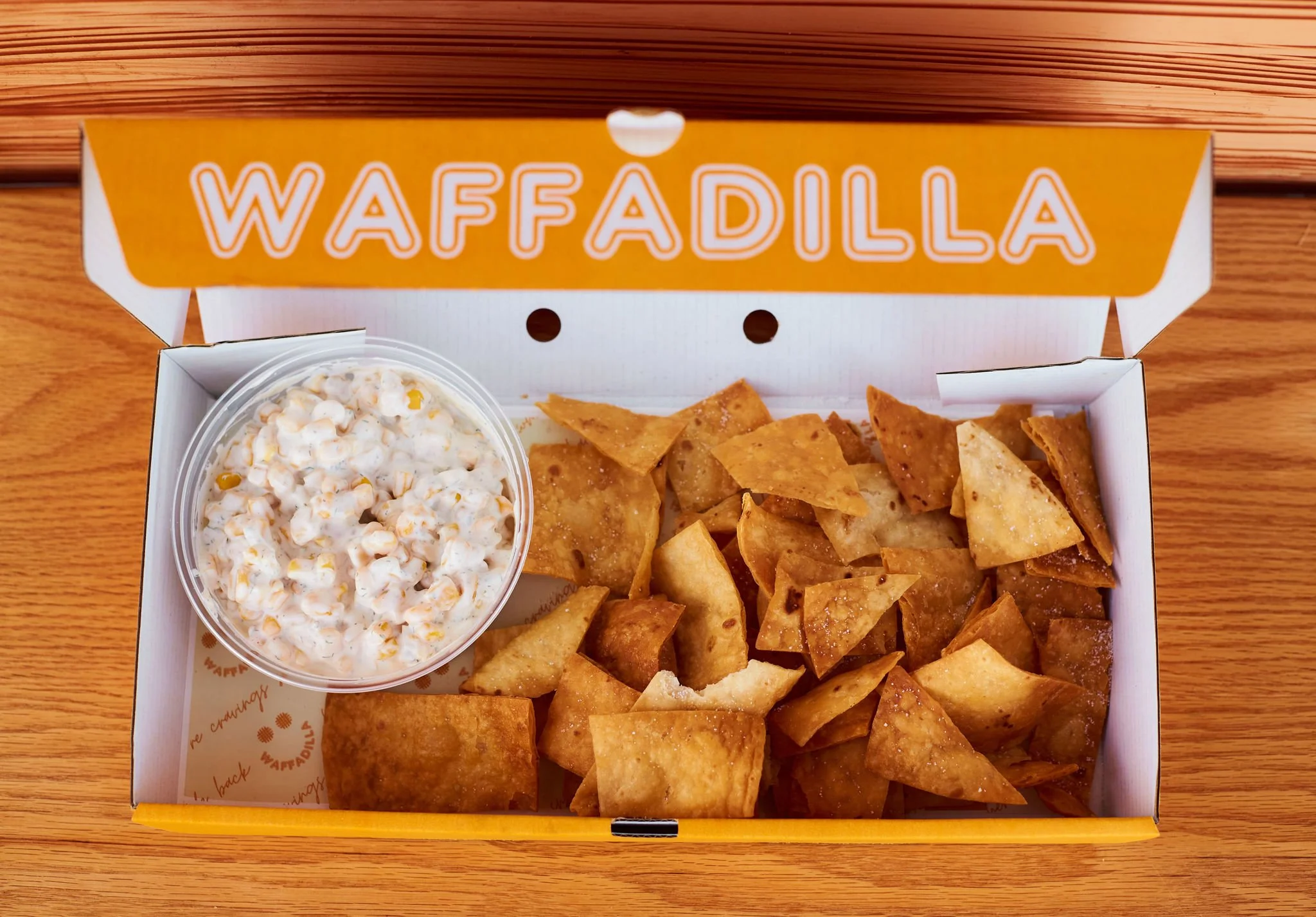 CORN N’ CHIPS

Crispy homemade tortilla chips served with our refreshing corn relish and topped with your choice of hot honey or lime-infused salt.