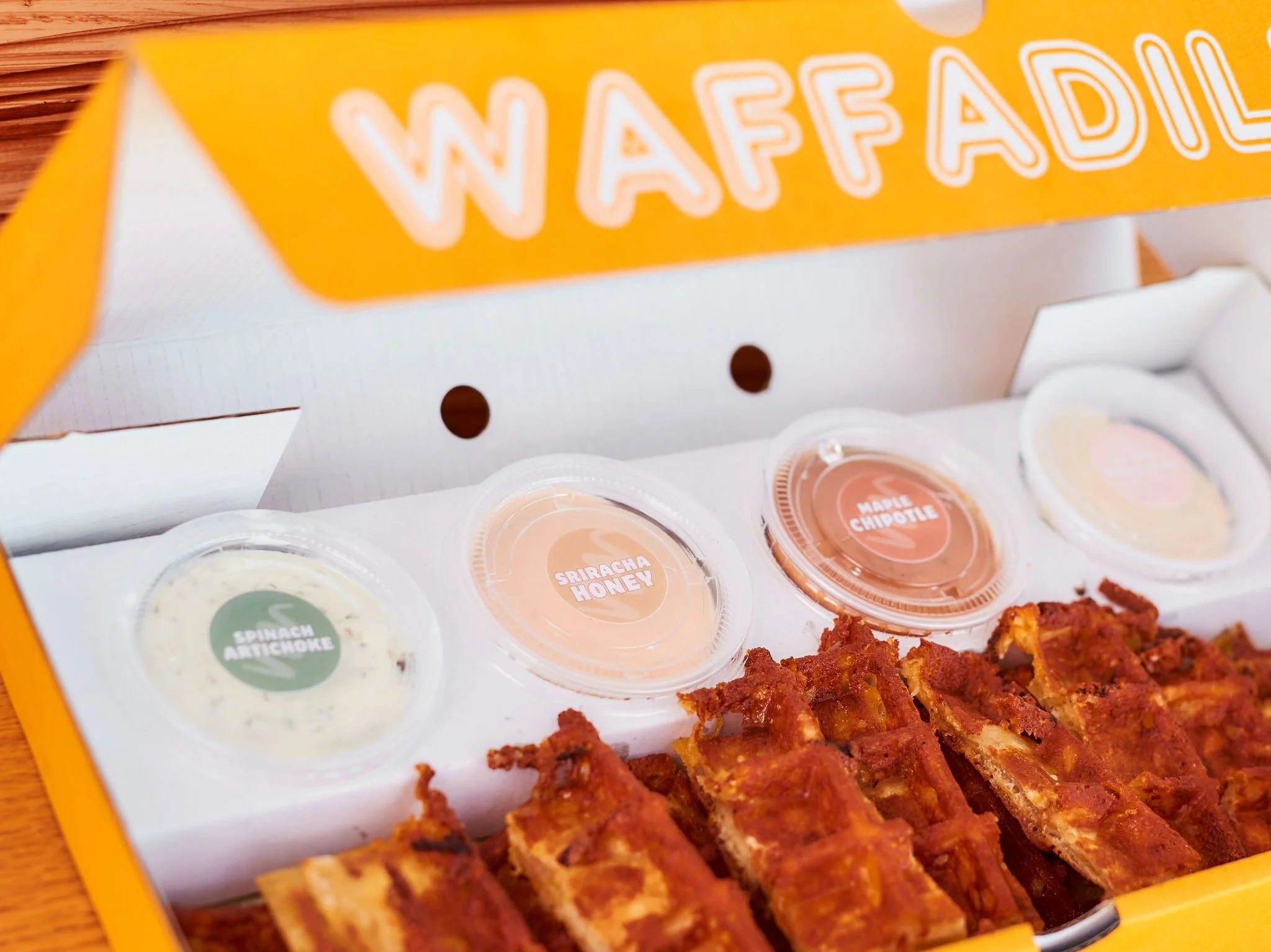 DILLA DUNKERS

Crispy waffle-pressed strips made for dipping, sharing and loading up with our signature sauce flight.