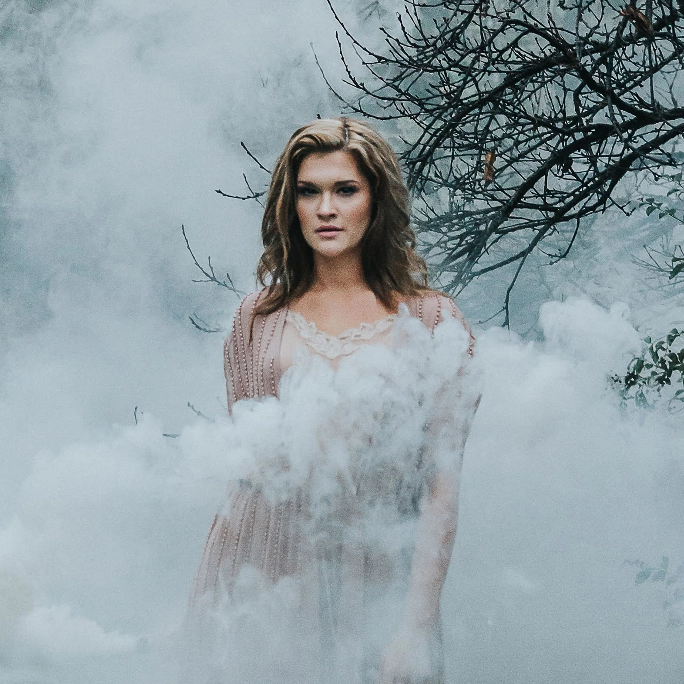 Photo of Cameron DuBois shrouded in smoke and fog