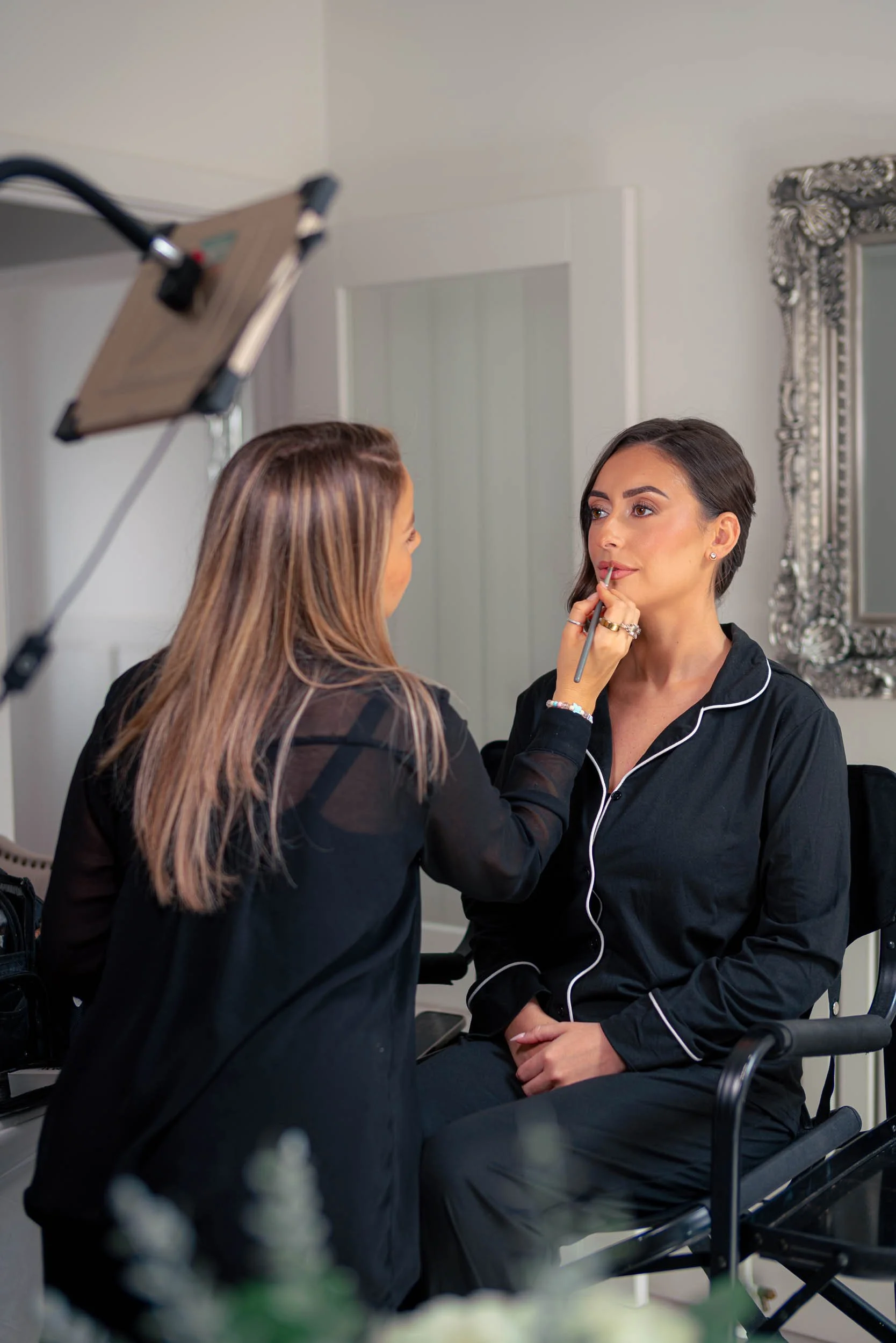 Bridesmaid having makeup applied