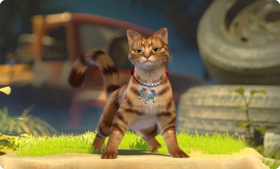 A living room scene with a house cat wearing jewelry, standing on a patch of grass with a blurry vintage truck in the background.
