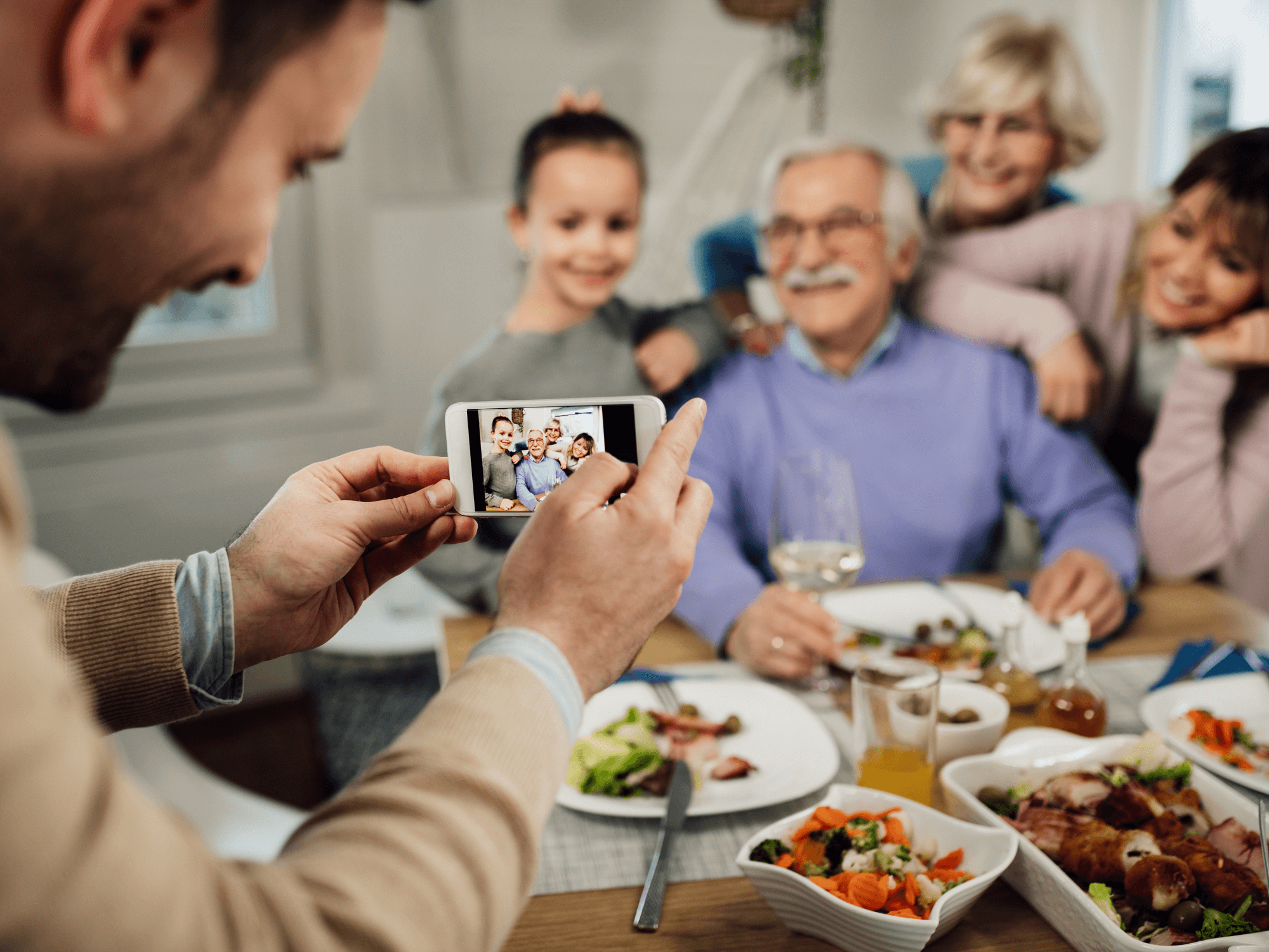 Multi-generational family eating dinner together