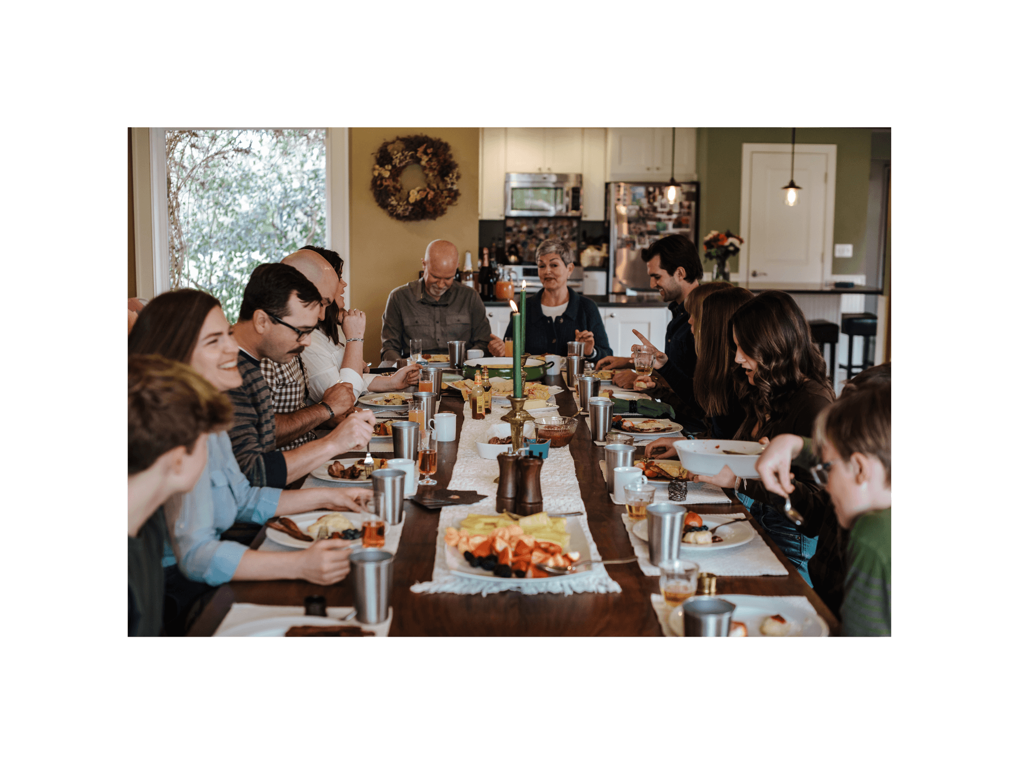 Multi-generational family eating brunch together around the table, including Molly Brumfield, creator of the course Before You Say Yes