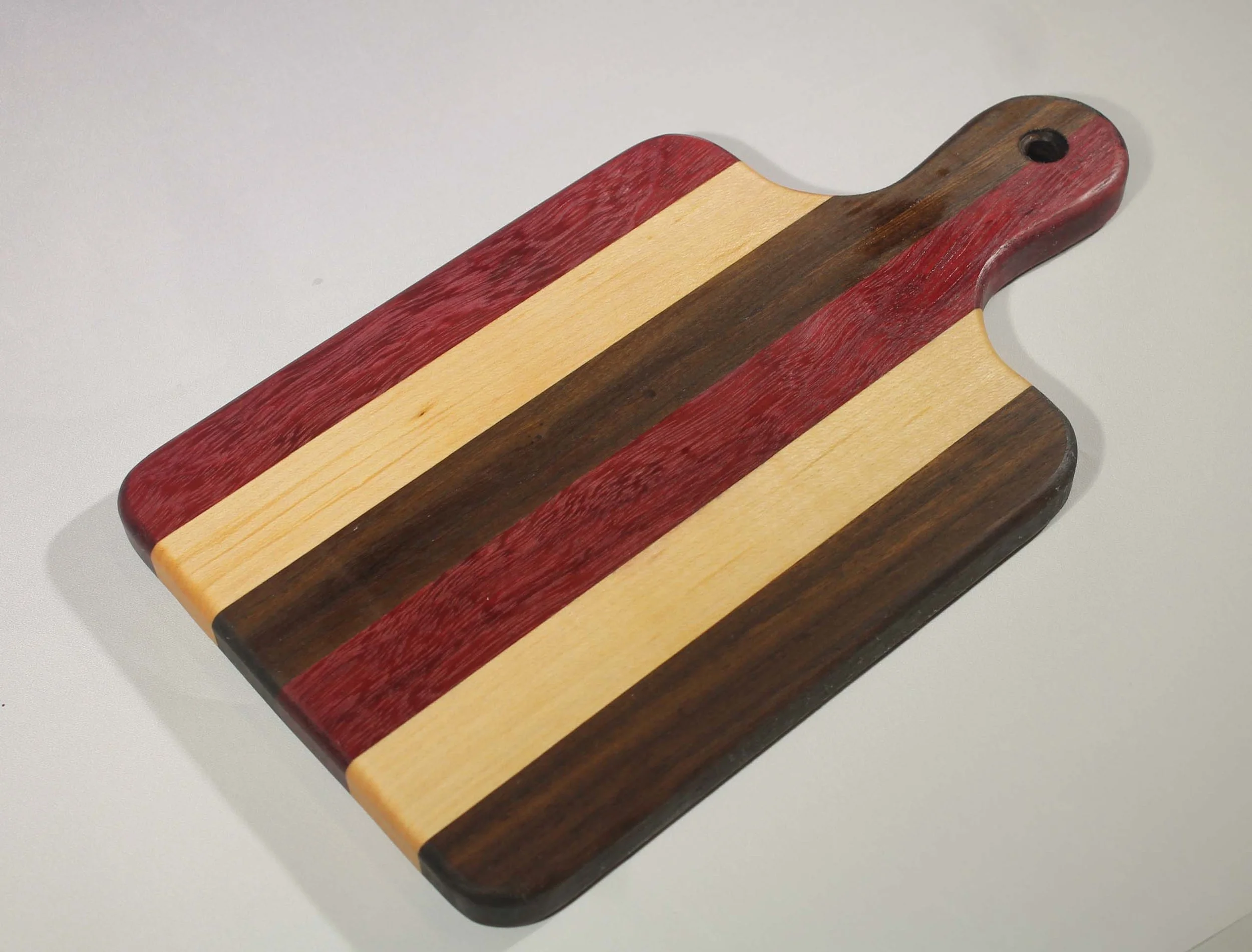 CB45 - 6” x 10 ¾” Cutting board with handle.
$35