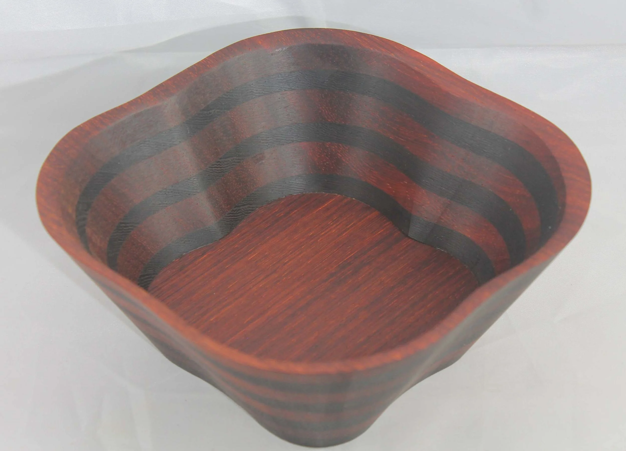 #6309 - Wenge / Paduk 4 Pedal Wedge Bowl
6 ¾” x 6 ¾” x 3” high
Finished with Walnut Oil
$45