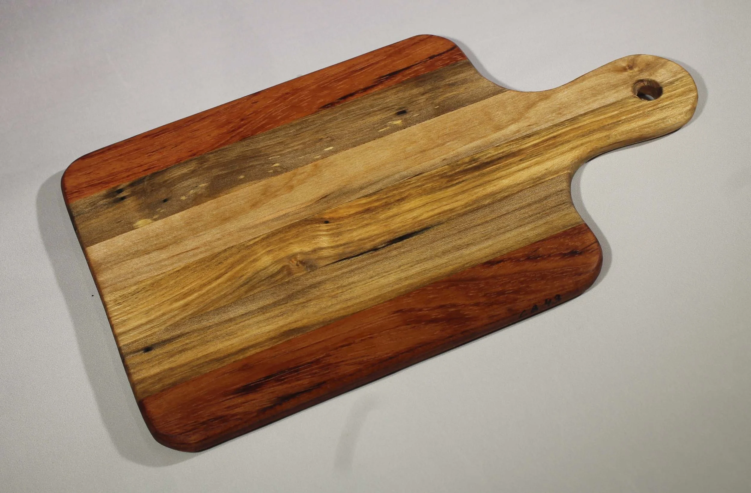 CB43 - 6” x 10 ¾” Cutting board with handle.
$35