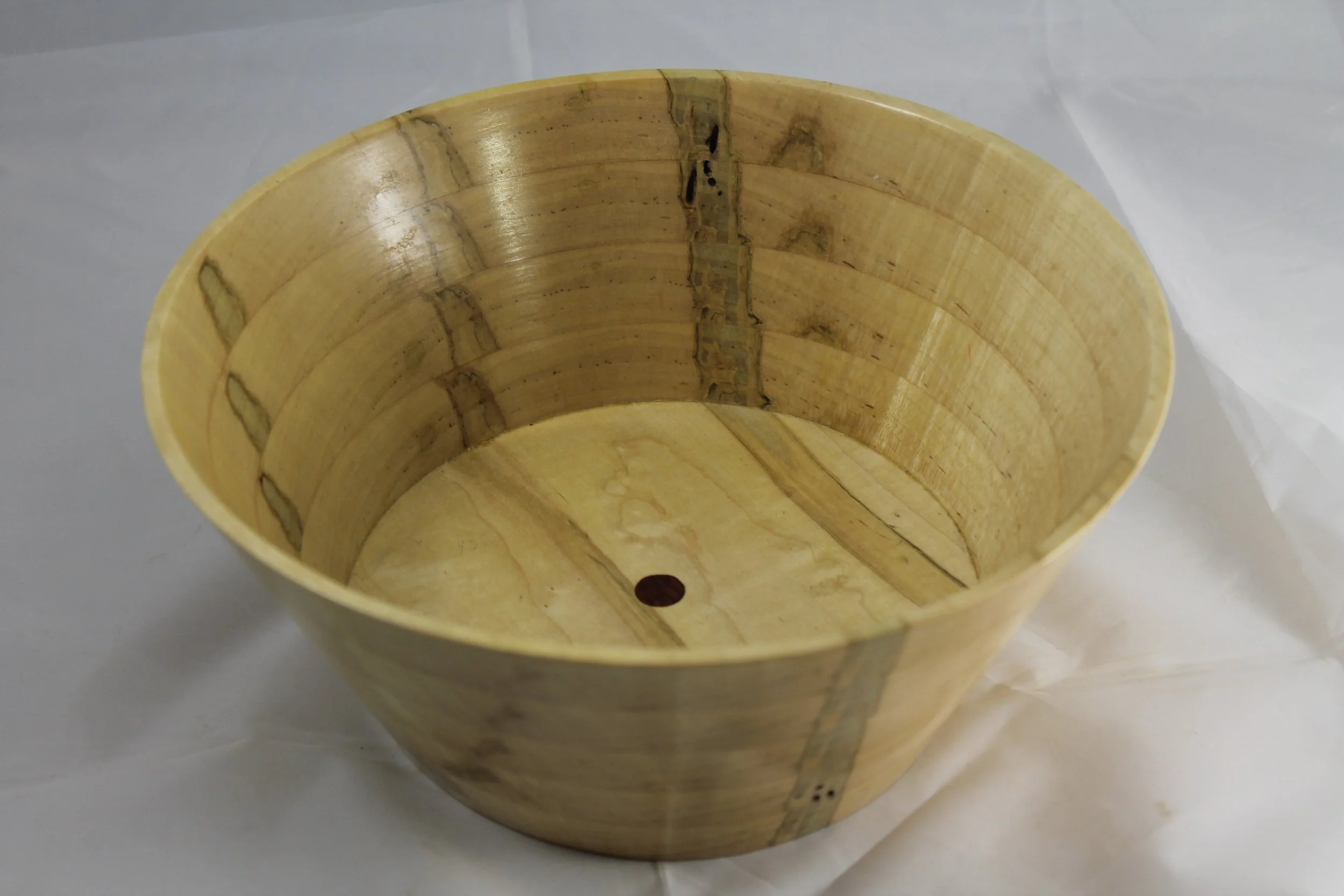 #1 -    Ambrosia Maple This bowl is made of Ambrosia Maple. It has a Bubinga plug in the center.
 This bowl is 9 ½” in diameter and 4” high. 
$50