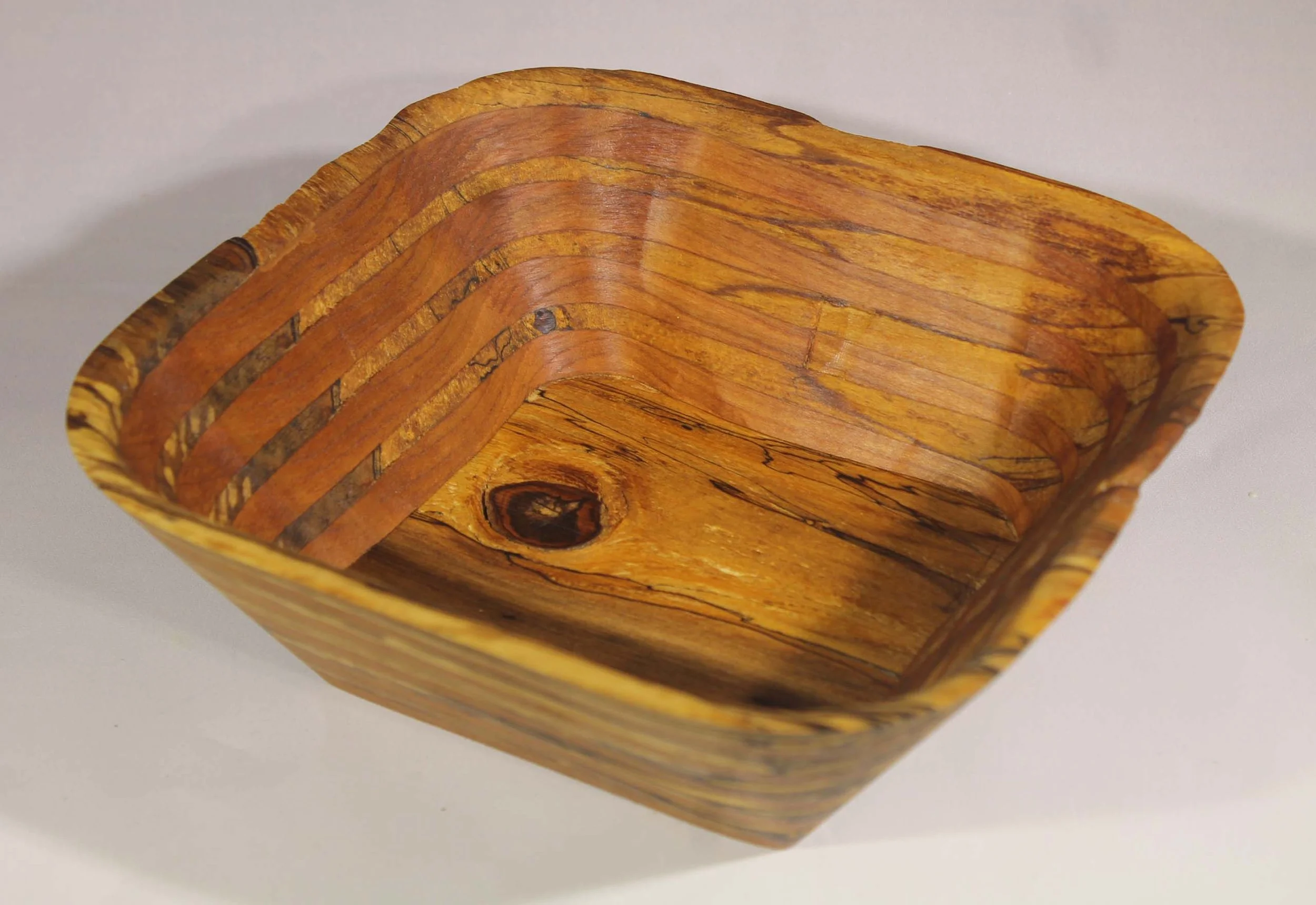 #6348  -  Spalted Pecan / Cherry Rectangular Wedge Bowl

This is my signature wedge design with spalted Pecan wood (that is punky and starting to rot) and Cherry.     The texture of this bowl is fantastic.  You can see the dark streaks from the spalt
