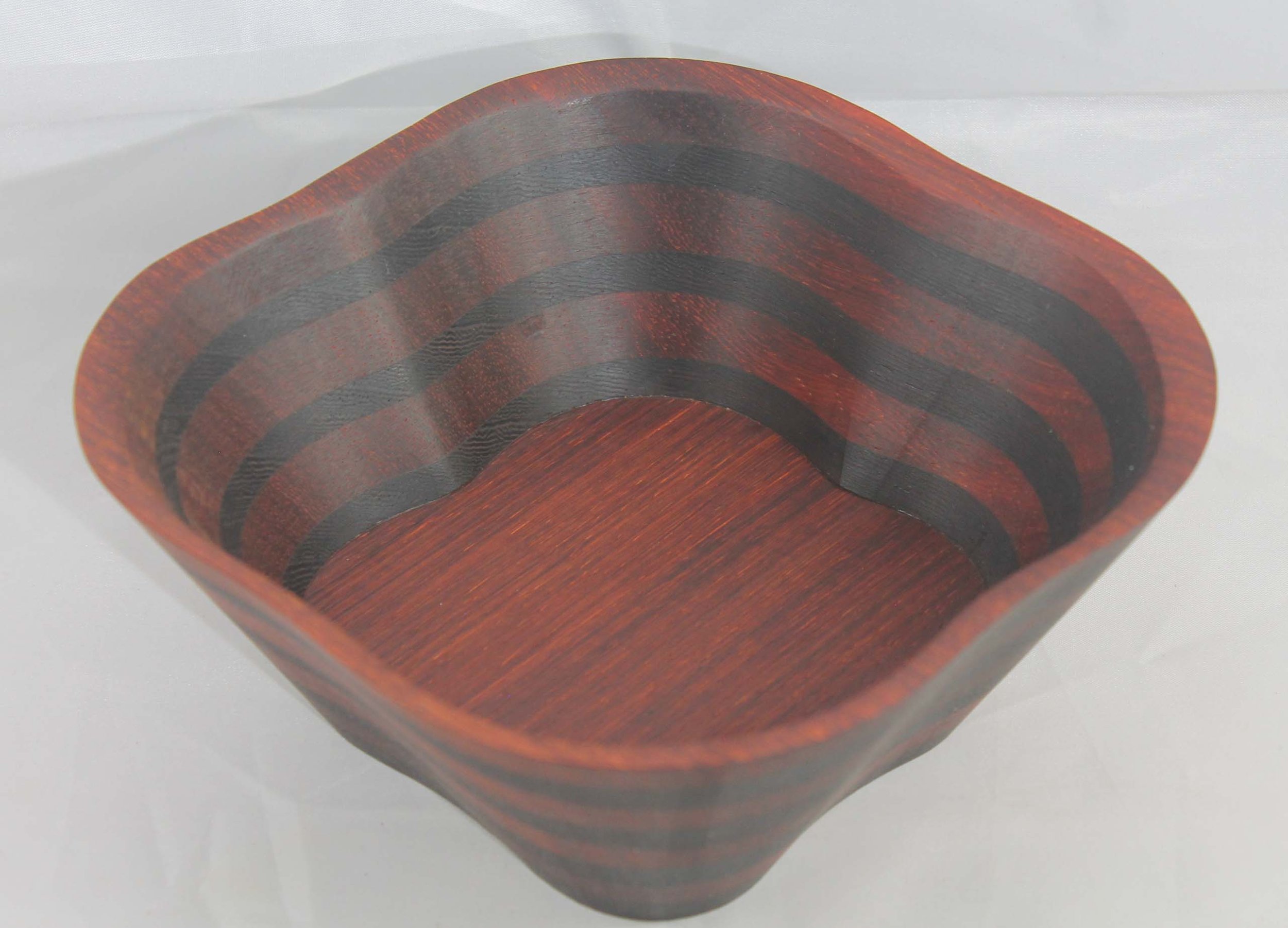 #6309 - Wenge / Paduk 4 Pedal Wedge Bowl
6 ¾” x 6 ¾” x 3” high
Finished with Walnut Oil
$45