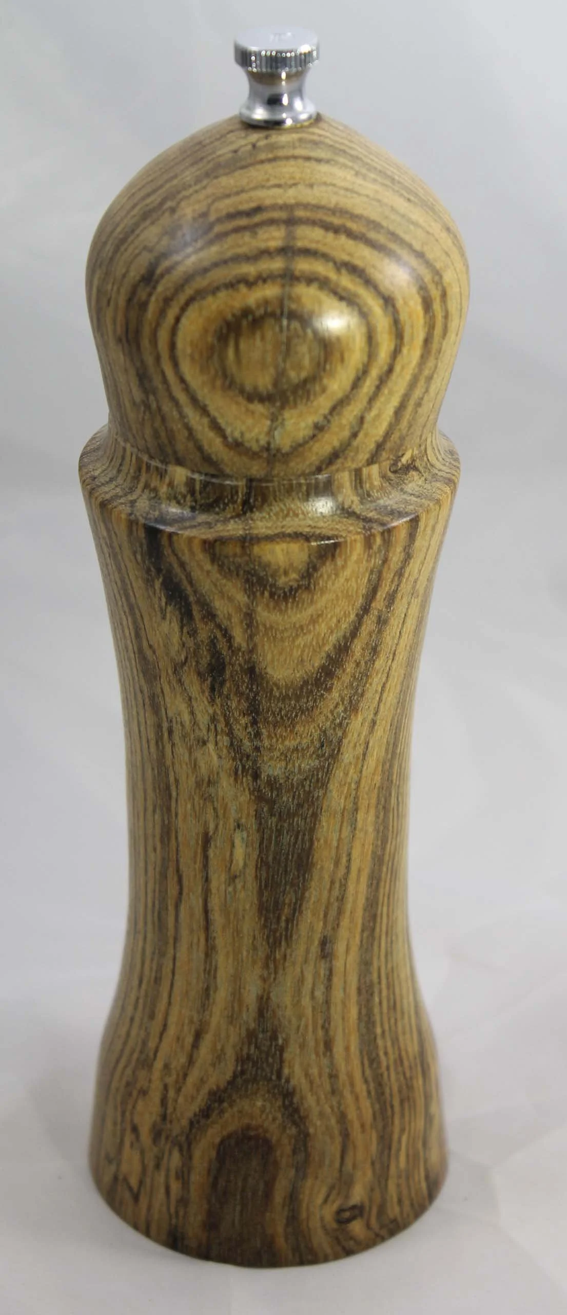 PM11  -  Bocote

This pepper mill is from Bocote wood, native to Mexico and Central America.  
Bocote has unique grain patterns from straight lines to swirls to bird's eye figure. It is easily workable and contains a high oil content which helps to a