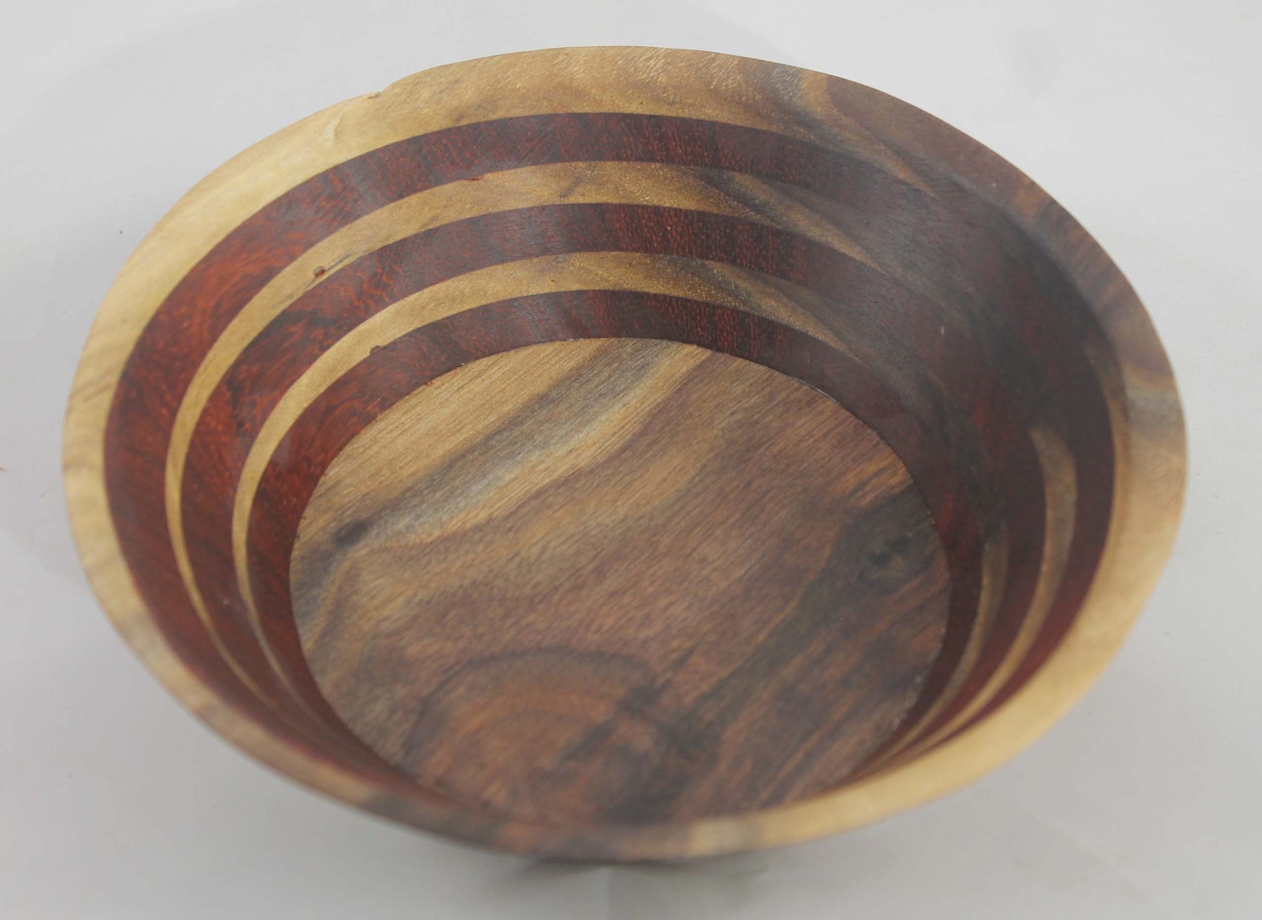 #6319 - Walnut / Paduk Wedge Bowl
Round bowl
6 ¾” ɸ x 2” high
Finished with Walnut Oil.
$45