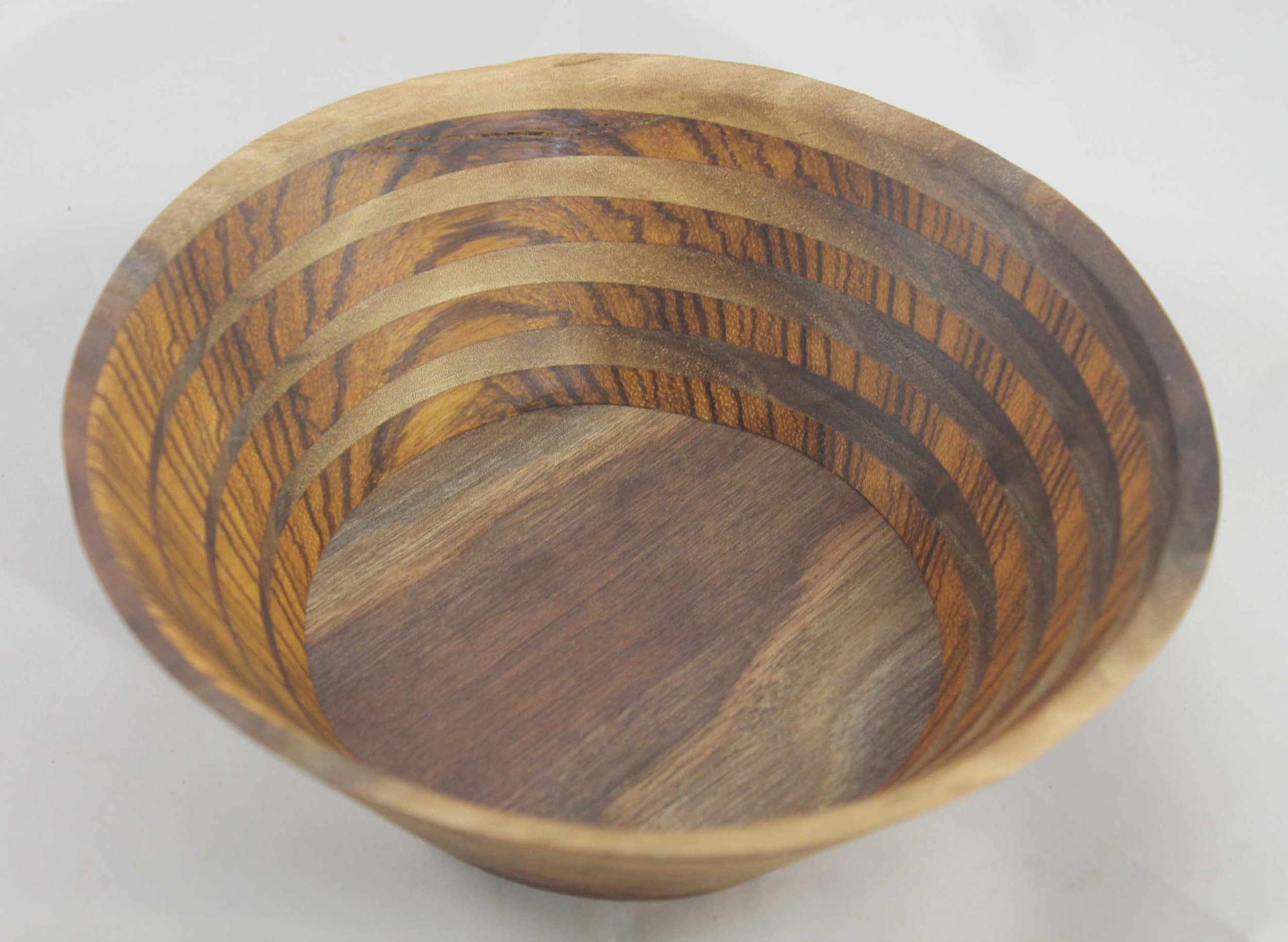 #6321 - Zebrawood / Walnut Wedge Bowl
Round
6 ⁵⁄₈” ɸ x 2 ¼” high
Finished with Walnut Oil
This is my signature wedge design with the striped Zebrawood being broken up by the Walnut.
$50