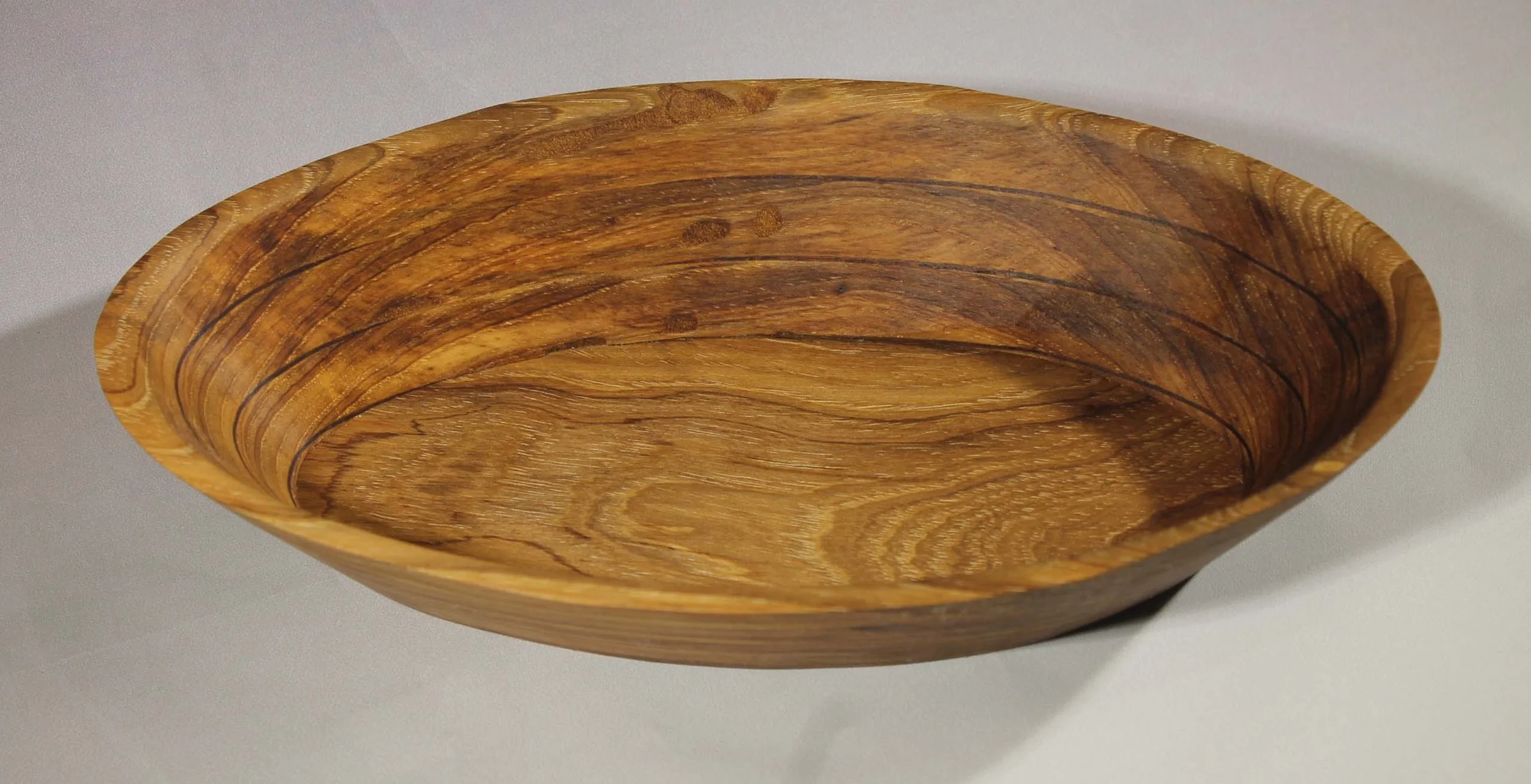 #6354 - EElm / Purpleheart / Makore veneer Wedge Bowl
This is my signature wedge design with Elm and Purpleheart woods with a Makore veneer between each segment.     The wedge effect gives this bowl character.  The colors of this bowl are light and a
