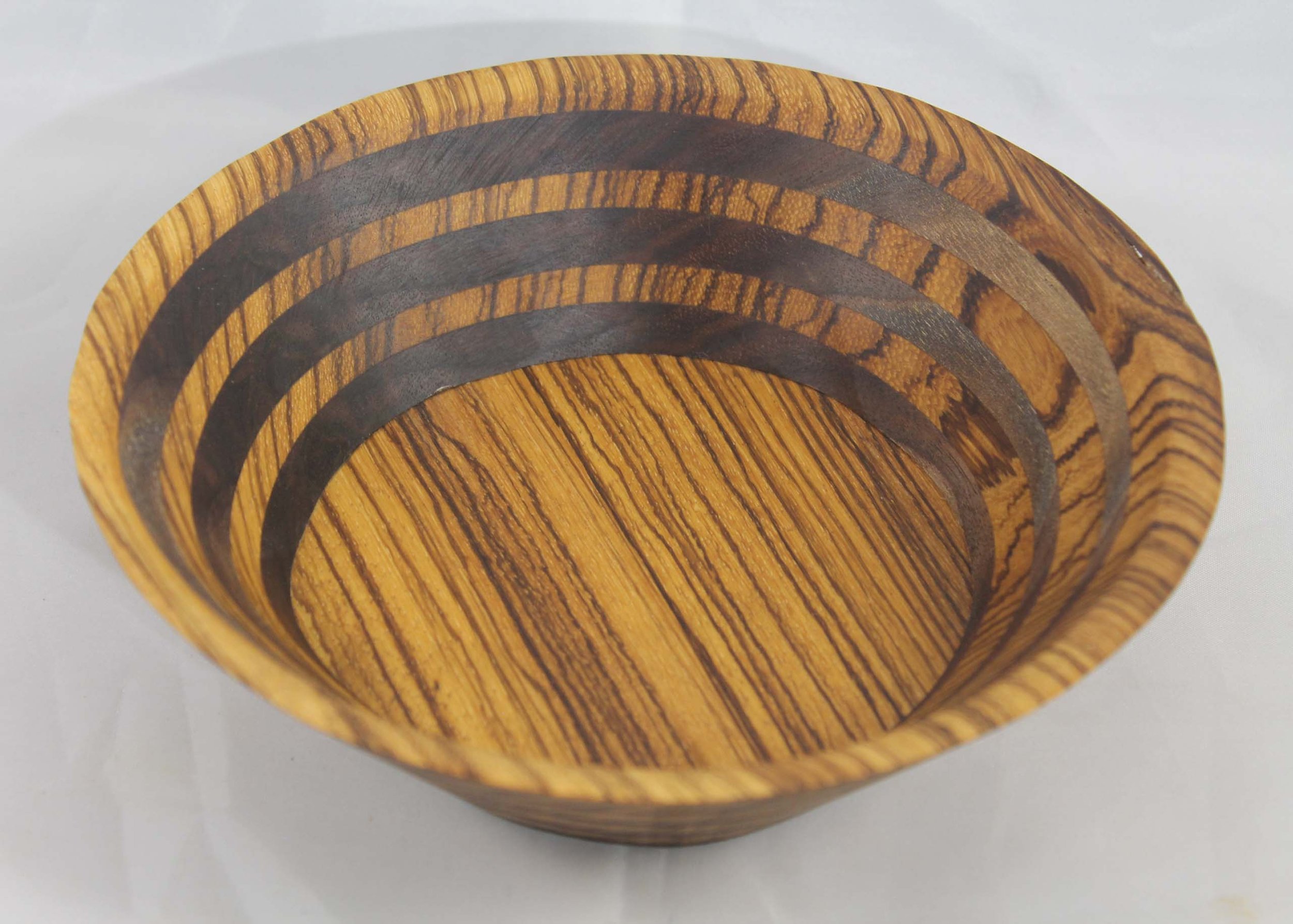 #6310 - Zebrawood / Walnut Round Wedge Bowl
6 ⁵⁄₈” ɸ x 2” high
Finished with Walnut Oil
$50