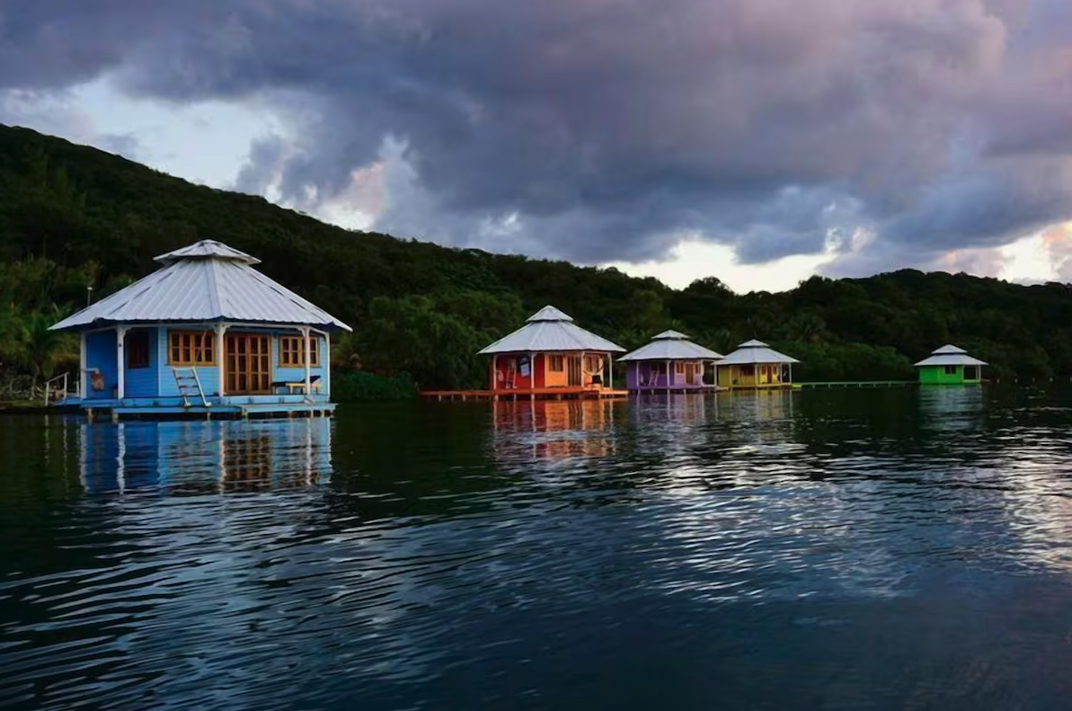 Yoga Retreat overwater colorful bungalows.png