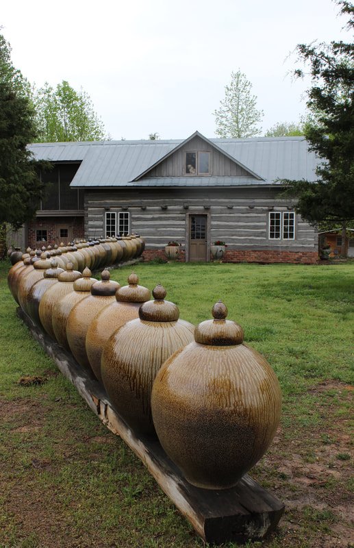 Row of Daniel Johnston's big jars