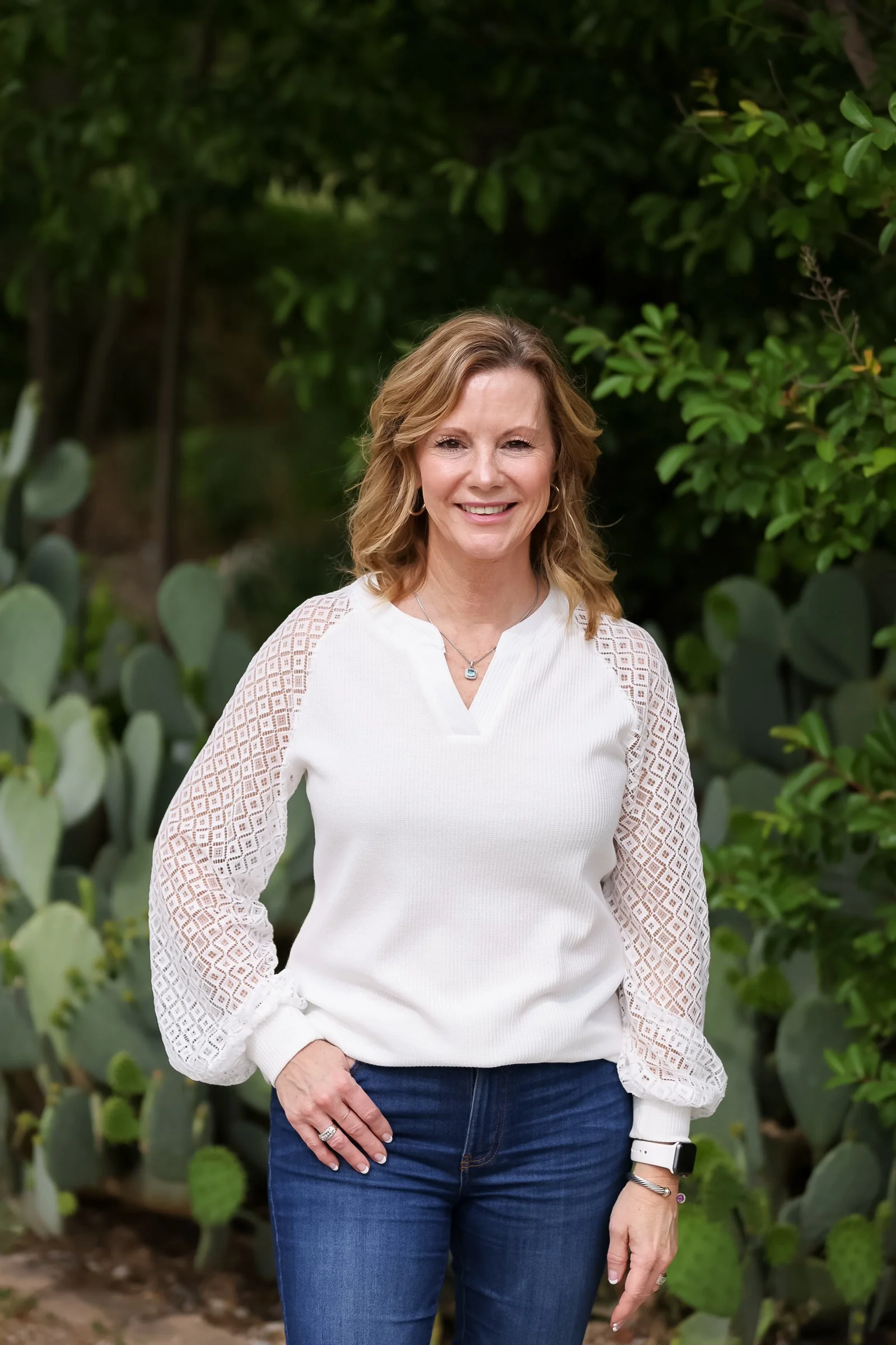 Terry, Office Manager, standing in front of The Chiropractic Place for Mommy and Me in Aledo, Texas