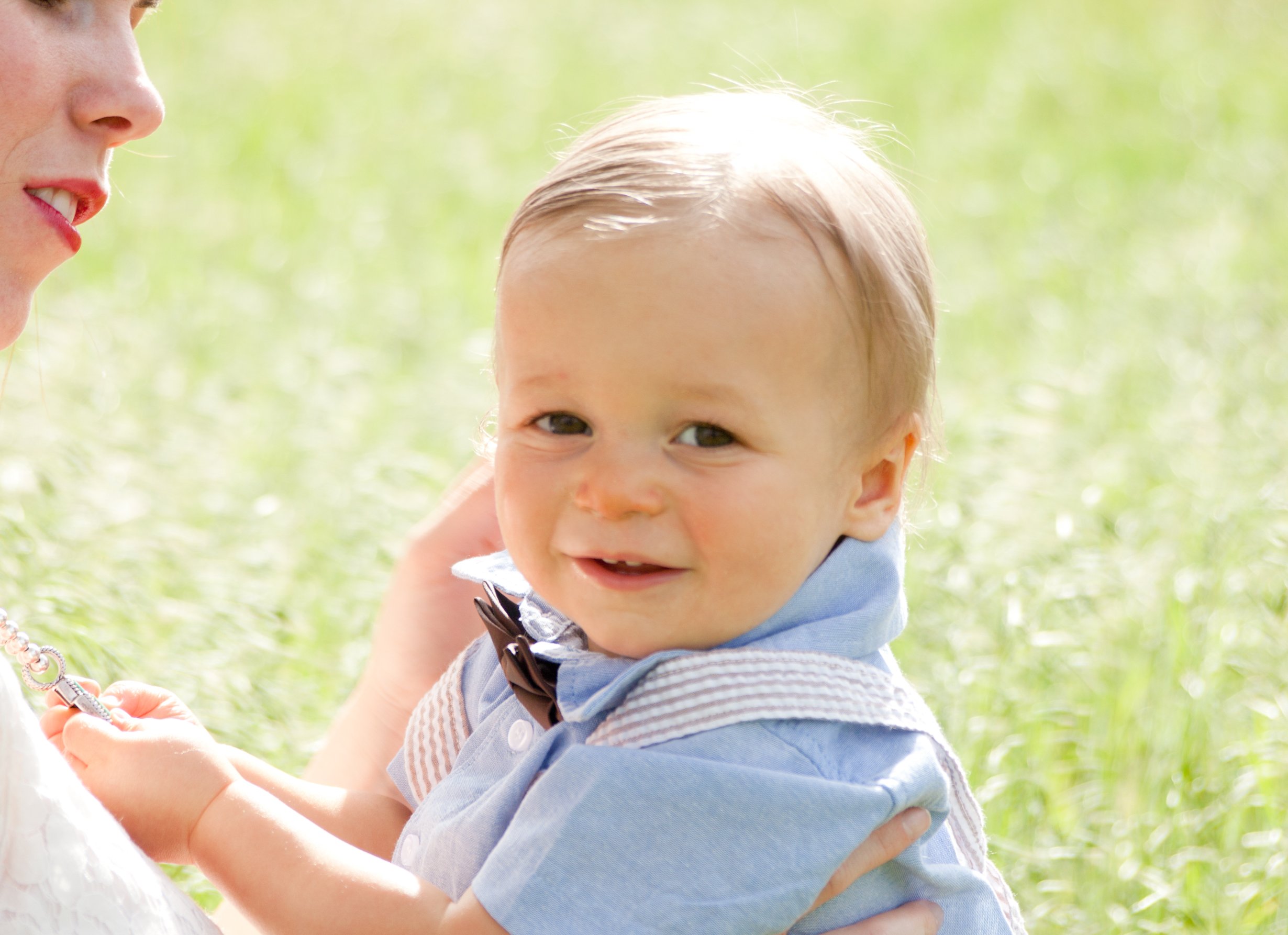 Baby after pediatric chiropractic adjustment sitting outside The Chiropractic Place for Mommy and Me in Aledo, Texas with a calm nervous system