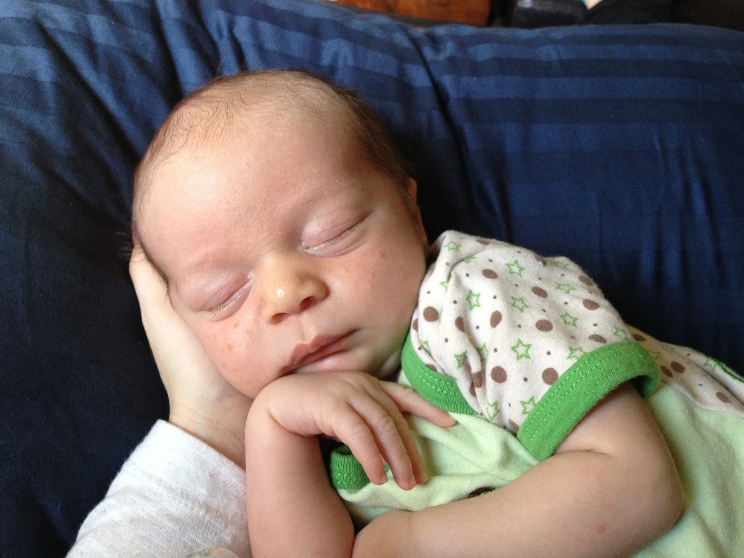 Newborn baby with reflux with pediatric chiropractic support at The Chiropractic Place in Aledo, Texas