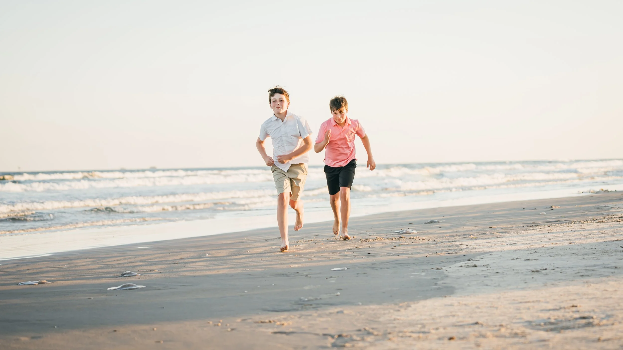 Elementary and Middle School Boys running on beach in Texas after their chiropractic adjustment from The Chiropractic Place for Mommy and Me in Aledo, Texas