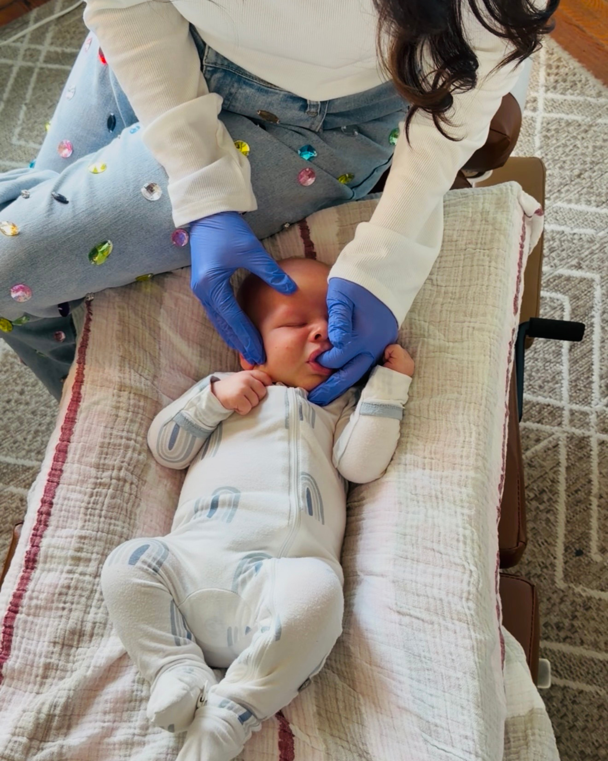 Gentle pediatric chiropractic adjustment for newborn for breastfeeding support at The Chiropractic Place for Mommy and Me in Aledo, Texas