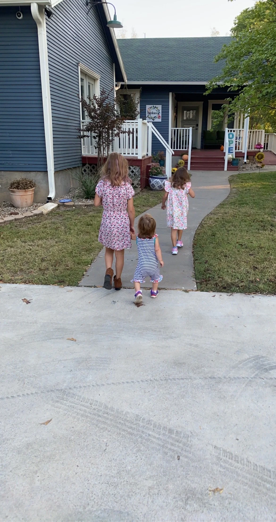 Three sisters walking into The Chiropractic Place for Mommy and Me for their childhood development chiropractic appointment in Aledo, Texas