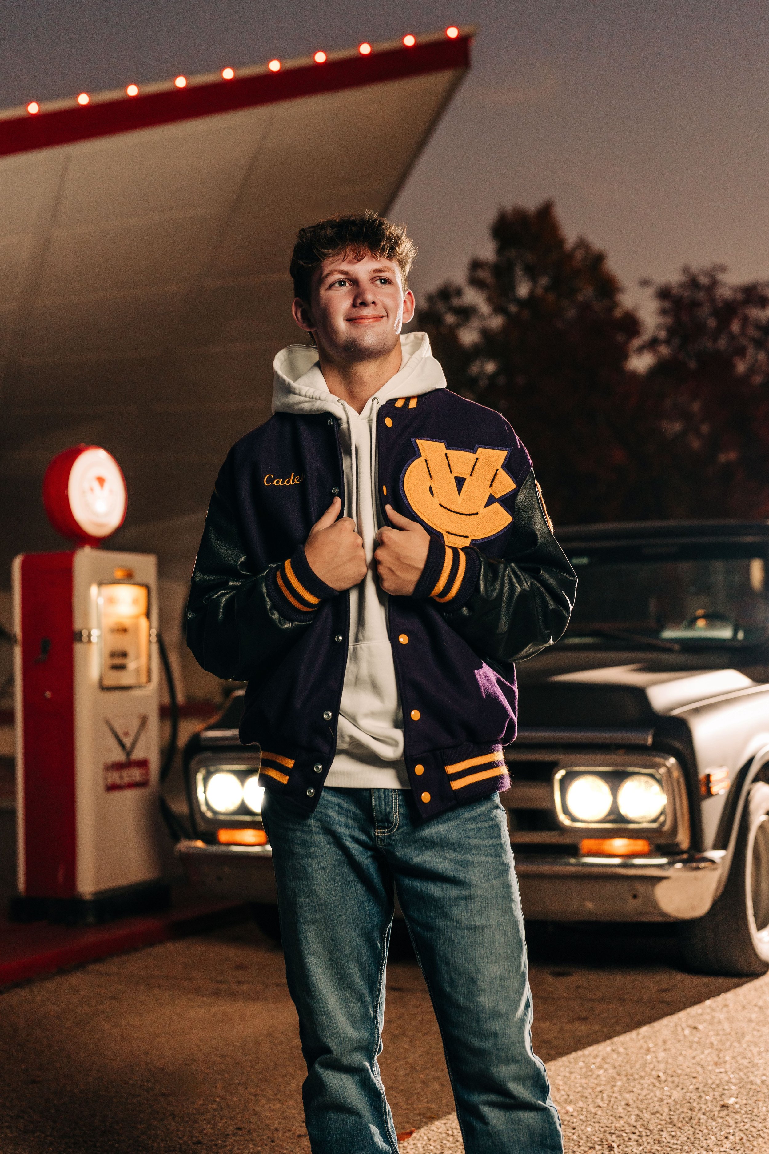 wichita senior photos guy letter jacket night shots.jpg