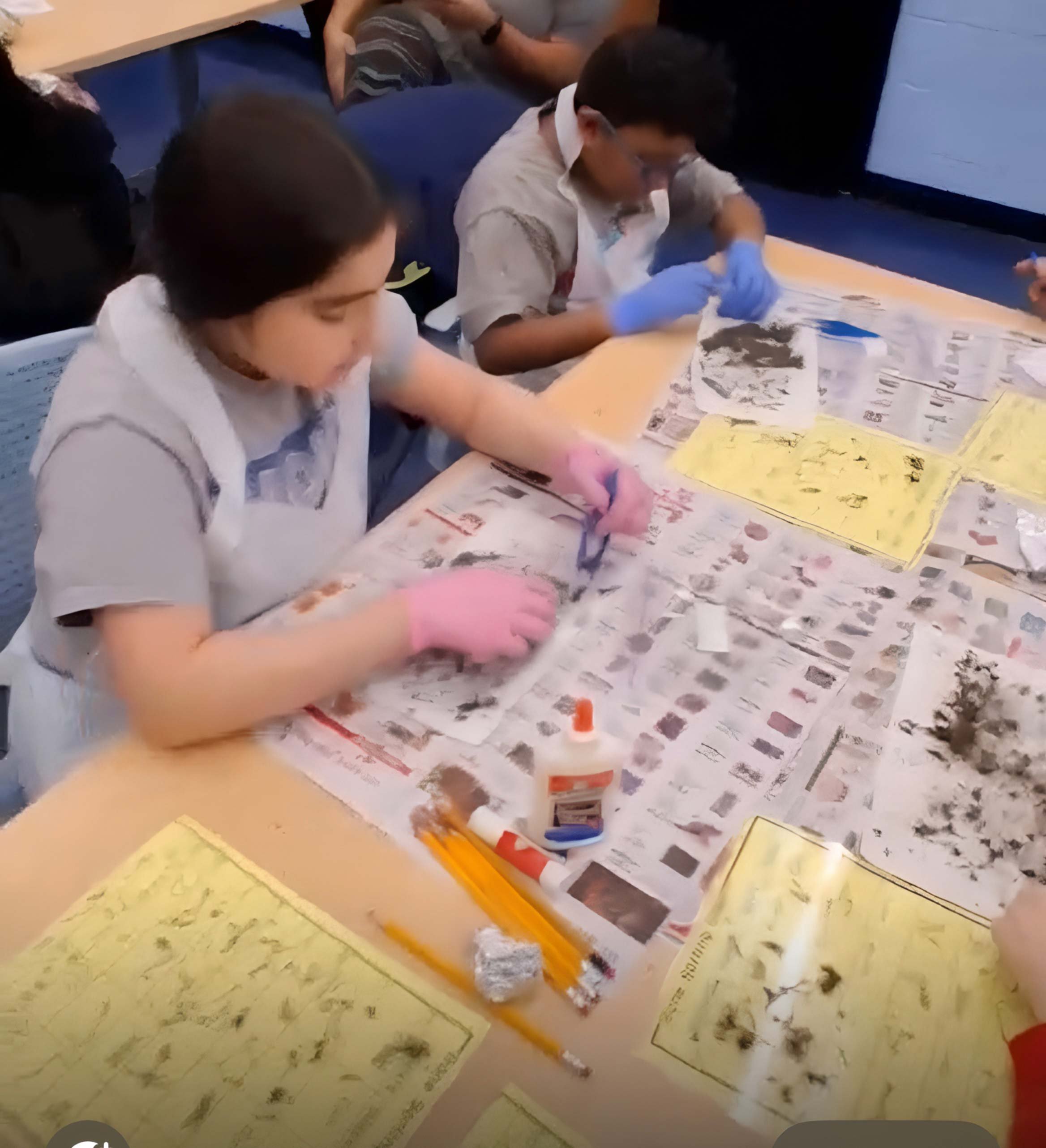 Students at our science workshop, dissecting owl pellets.