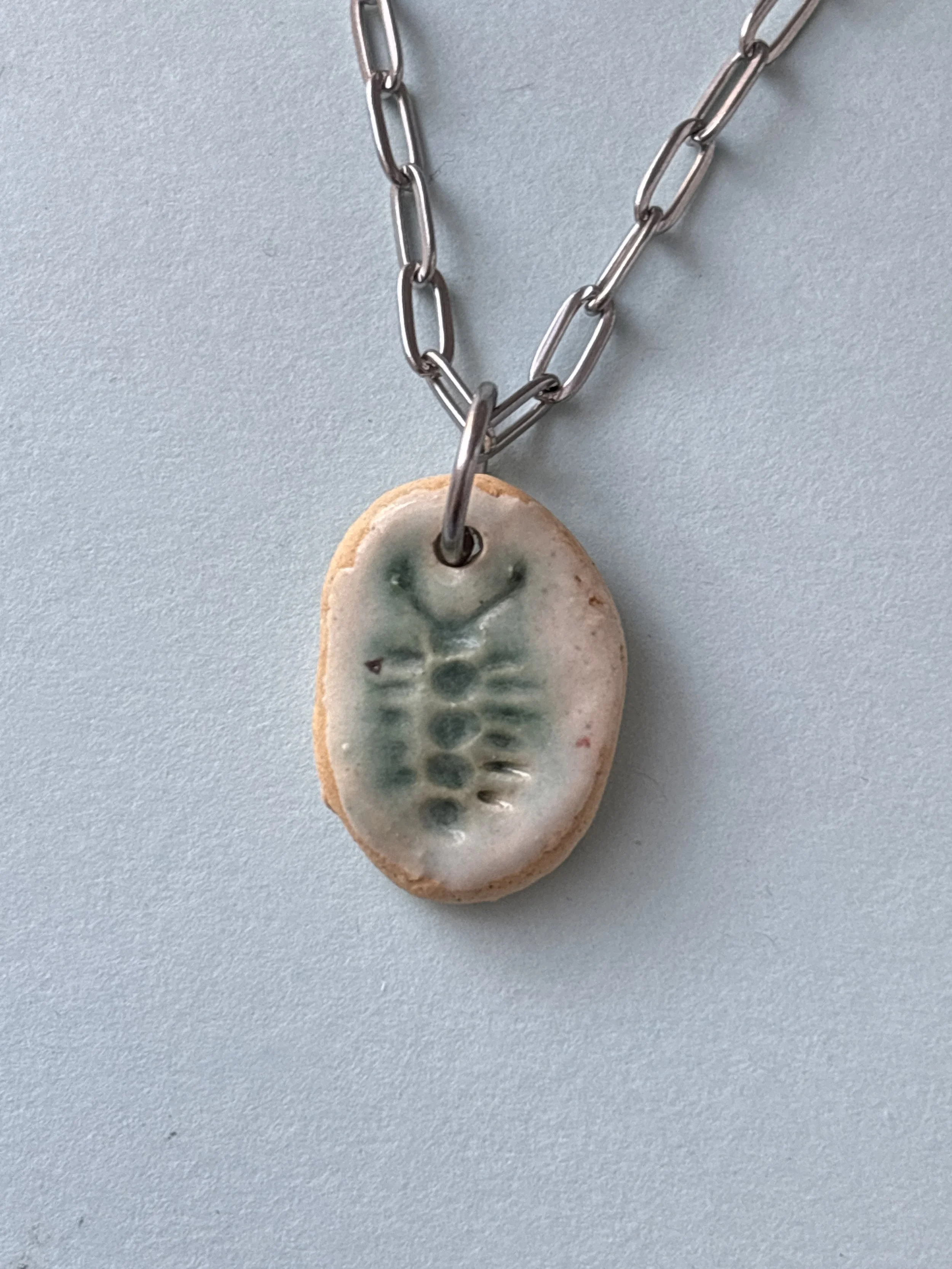bug fossil pendant (.7")