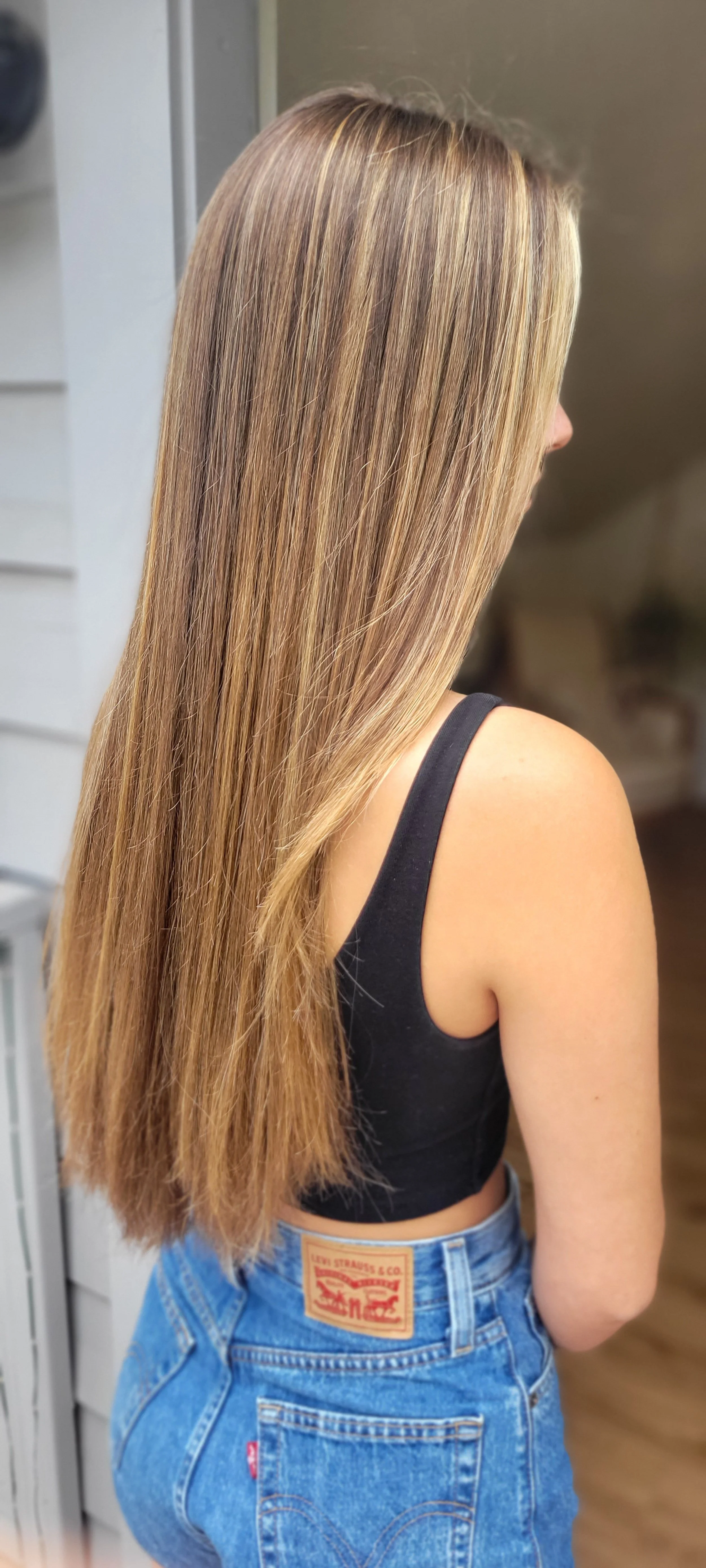Highlights and a root melt on long straight hair