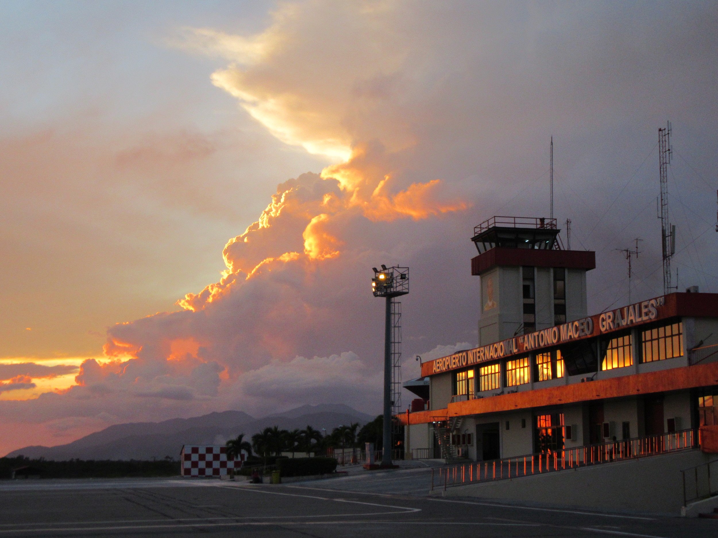 Brooding sky over Santiago airport. Our greeter held up a sign "Voces from Dhevacant Lot"