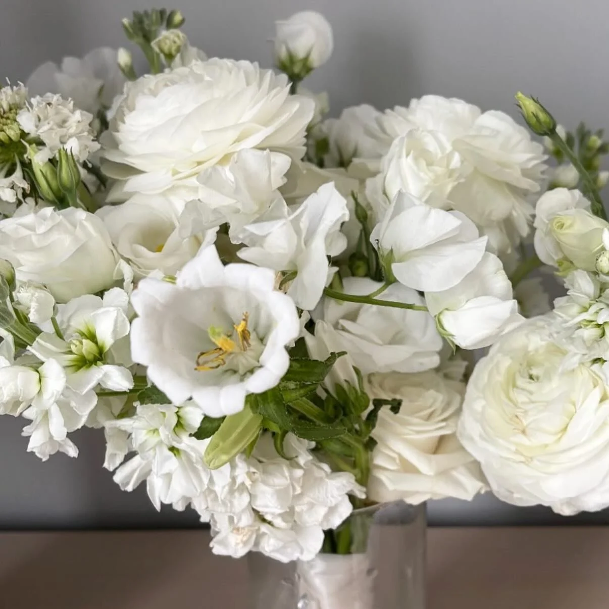 A closeup of a bridesmaid. And one pretty bridal with butter yellow ribbon 💛 

#weddinginspo #weddingflowers #easternshorebride #whitewedding #2026wedding