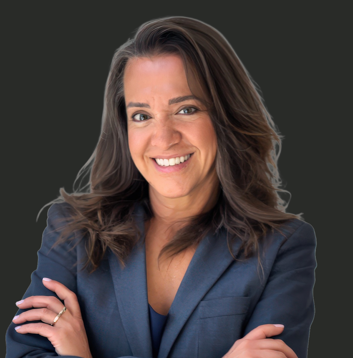 A smiling woman with long brown hair wearing a dark blazer and tapping her crossed arms, standing against a plain dark background.