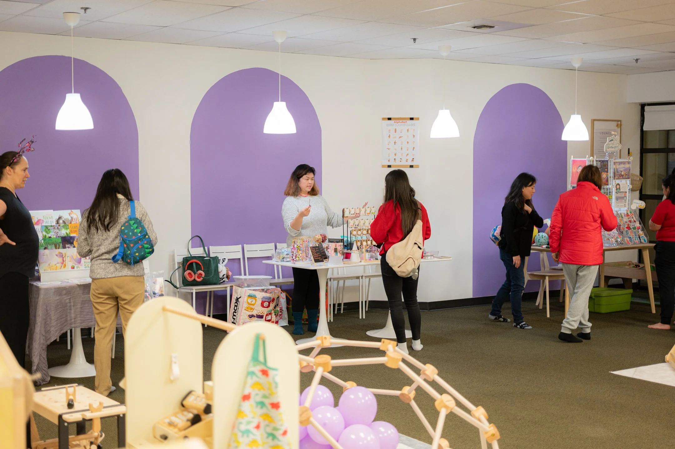 A cluster of groups in different tables, individual vendors selling their own handmade products