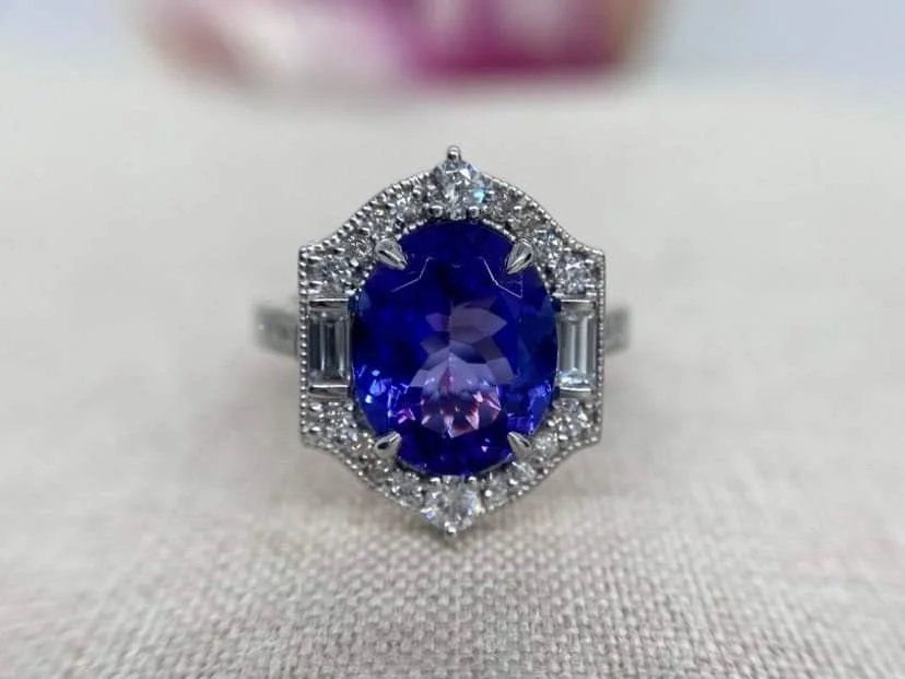 18ct white gold vintage style ring set with a 3.2ct tanzanite and 1.1cts of round and baguette cut diamonds.