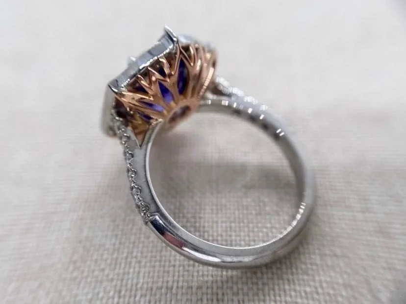 18ct white gold vintage style ring set with a 3.2ct tanzanite and 1.1cts of round and baguette cut diamonds.