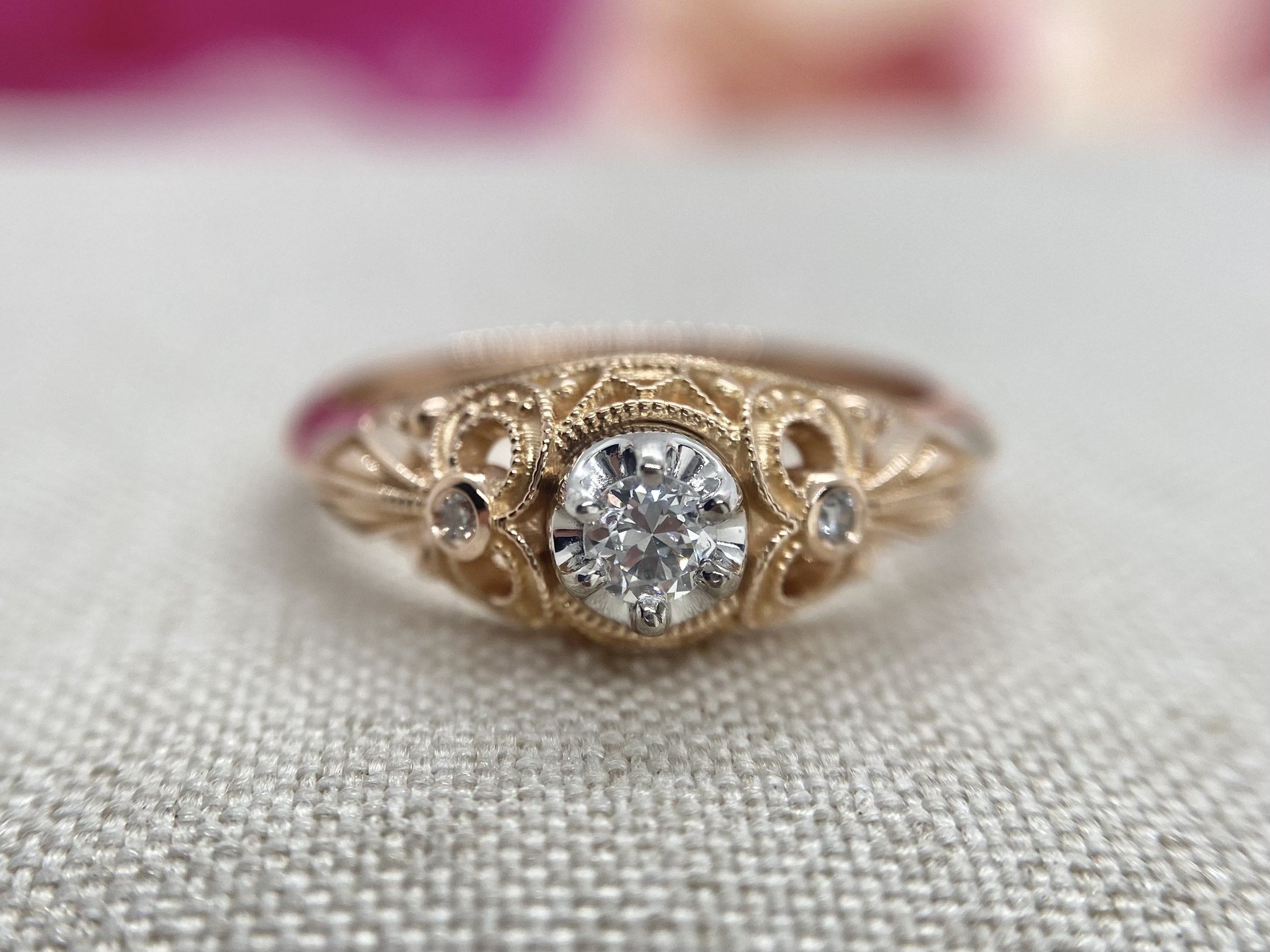 18ct rose gold vintage style ring featuring milgrain and bow designs on the sides. Replicated using 3D design technology.