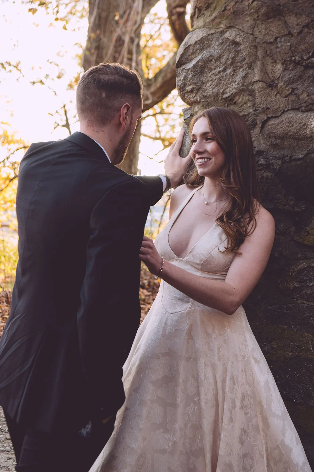 Alison lovingly looking into her future husbands eyes and an expression of true love is radiating from her face during their fall engagement session at Bancroft's Castle in Groton, MA. Photography by Mike Indi.