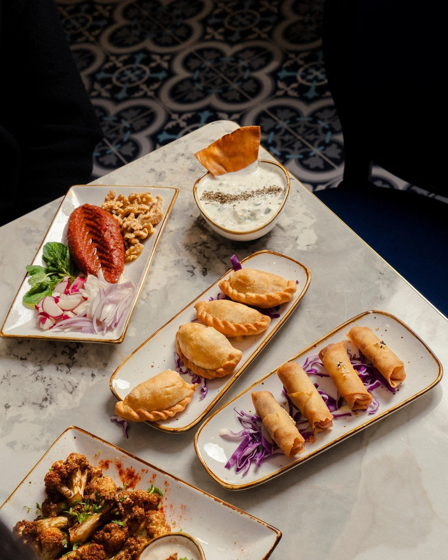For those moments when you want to try a bit of everything, our hot &amp; cold Mezzes are perfect for sharing. Our Sambouseks and Ladies Fingers are even hand sculpted to perfection so that every bite is is as good as the last.⁠
⁠
View our full menu 