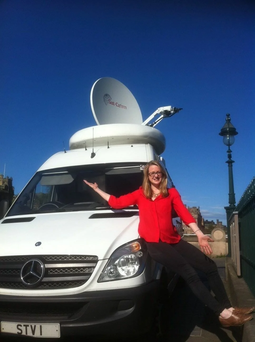 Reporter Kirsty Malcolm Live on Location for STV News with the Satellite truck