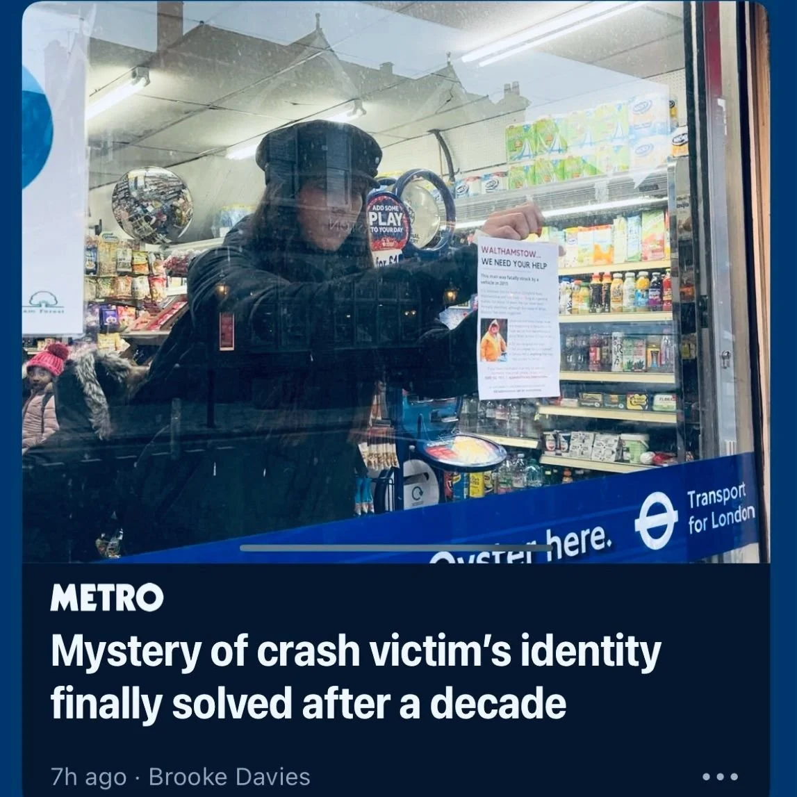 Freya putting up a poster in Walthamstow to help identify an unidentified case