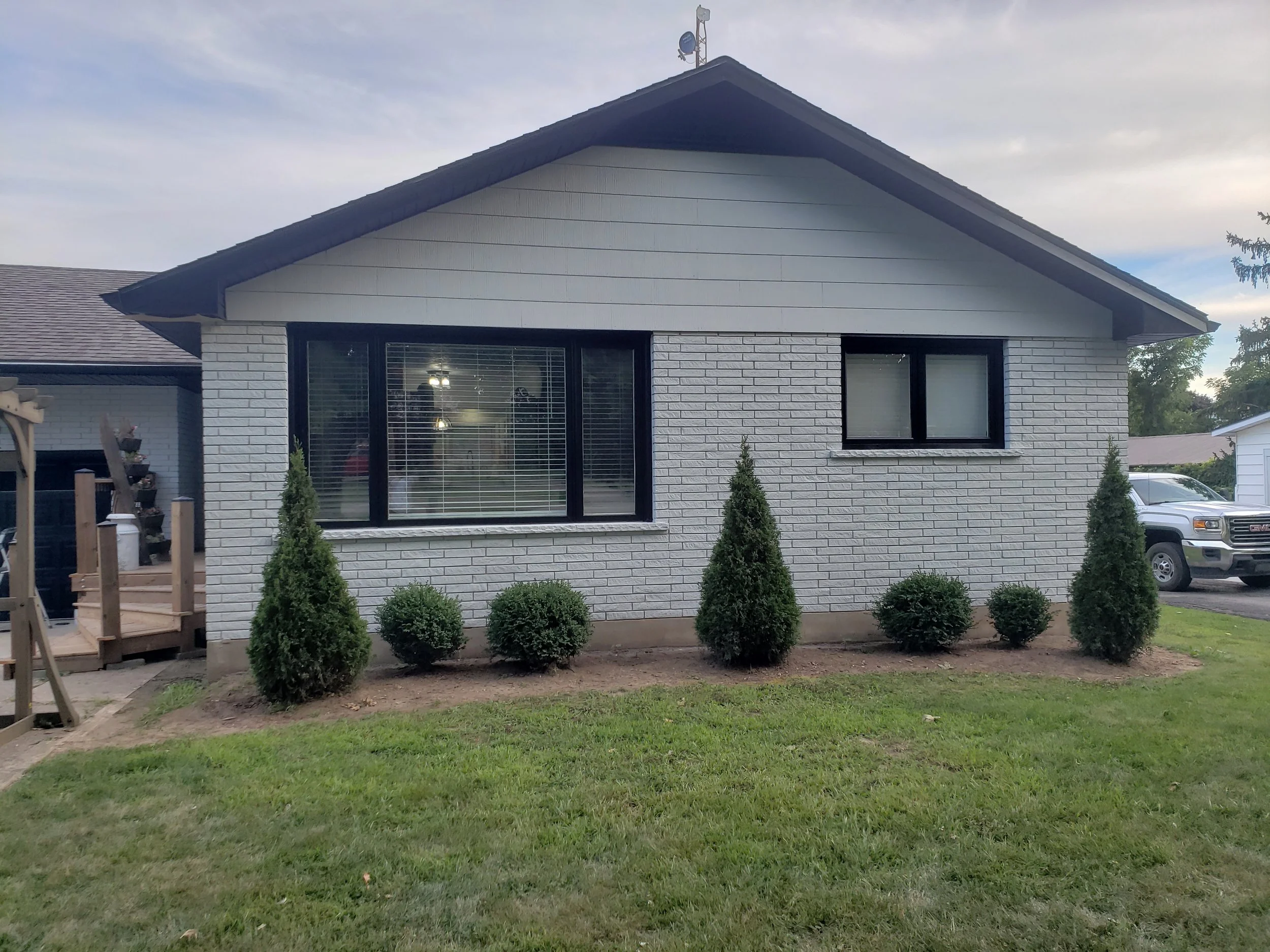 Brick, soffit, siding, window frames and doors