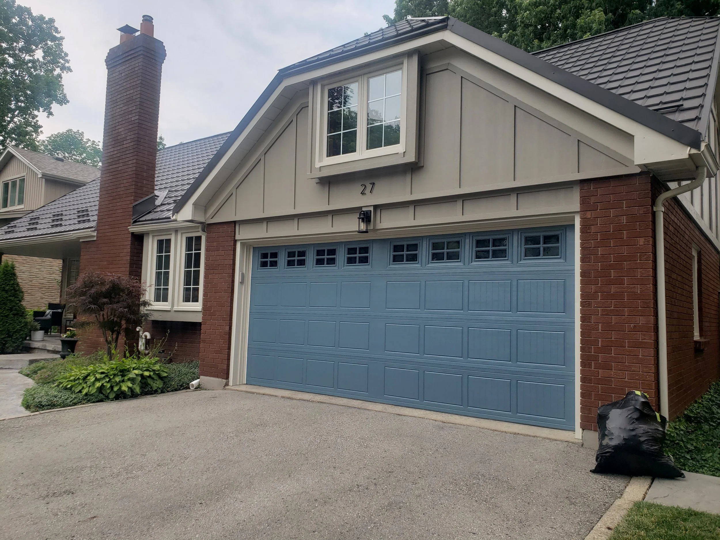 Siding, windows and garage door painted