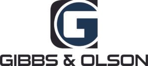 Gibbs & Olson logo with stylized "G" on a blue and black background.