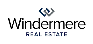 Windermere Real Estate logo in black and blue text with geometric symbol above the text.