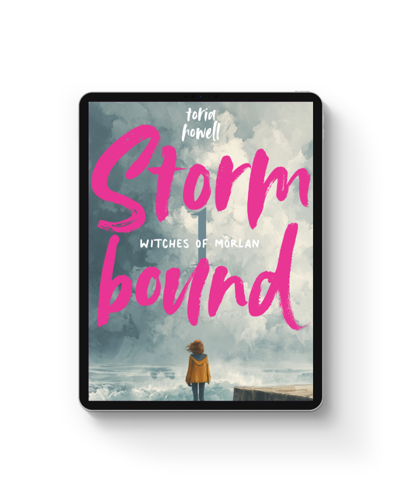 E-book cover titled 'Storm Bound: Witches of Morlan' by Toria Howell featuring a person with red hair in a yellow jacket standing on the water's edge, looking at a stormy sky.